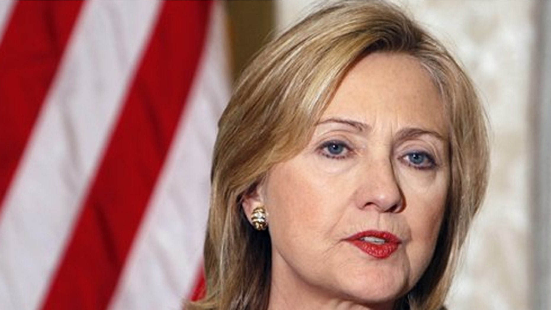 Secretary of State Hillary Clinton addresses reporters during a press conference at the U.S. embassy in Paris March 19.