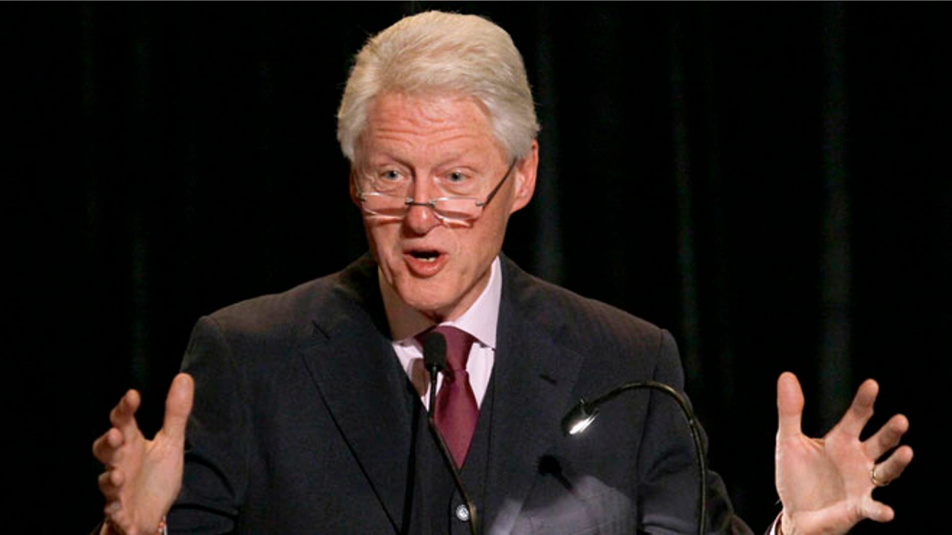 April 23, 2012: Former President Bill Clinton addresses the audience during the opening night dinner of the World Summit of Nobel Peace Laureates at the Field Museum.