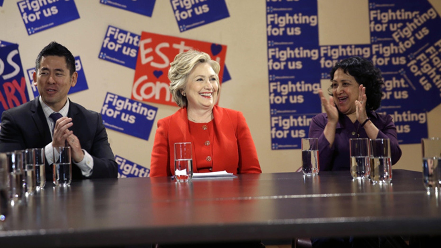 April 13, 2016: Democratic presidential candidate Hillary Clinton talks with local politicians and immigrant activists in New York.