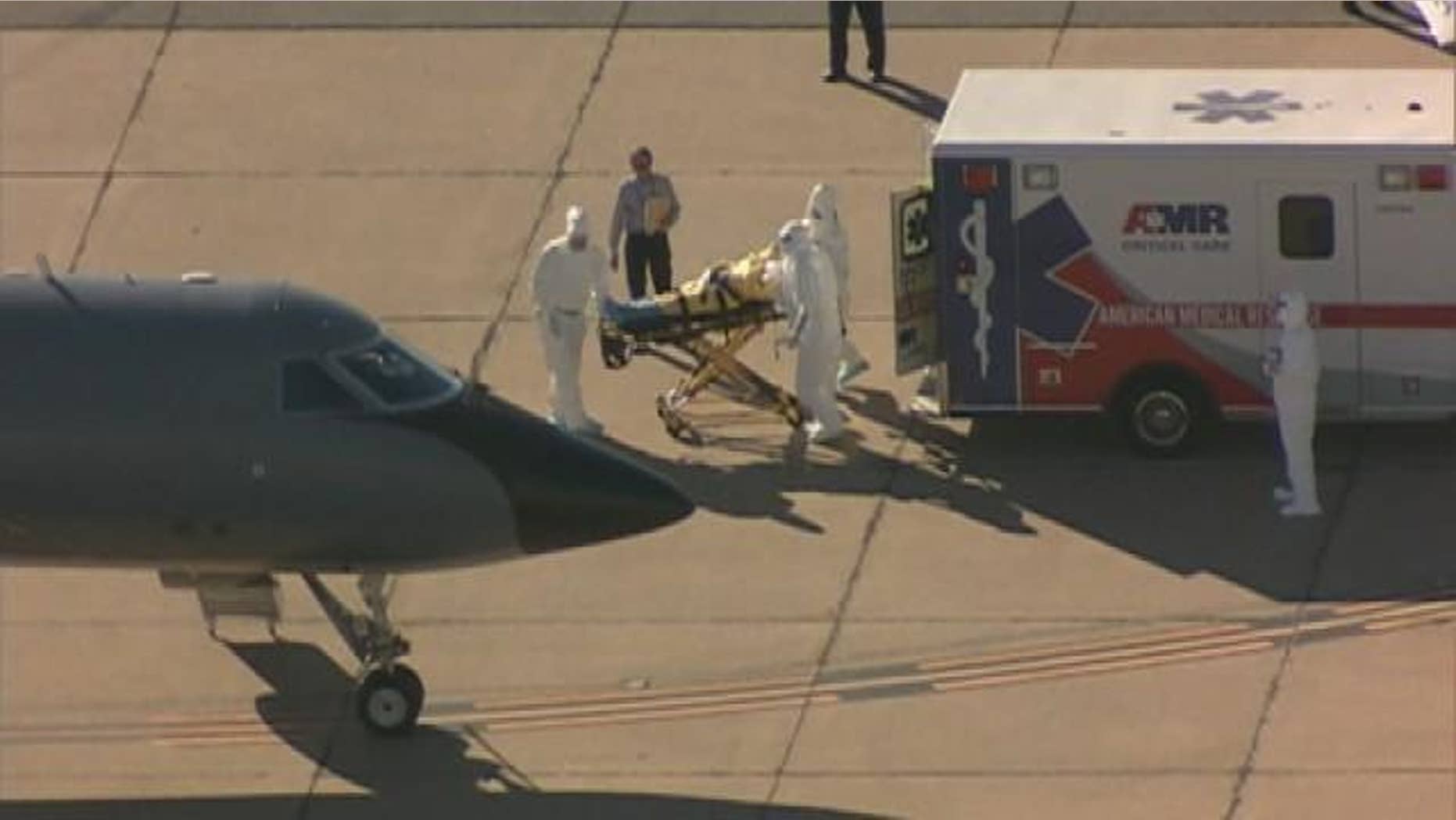 Dubbed #clipboardguy on social media, many Americans showed their concern for the man who wore sunglasses, long-sleeved gray shirt, and dark pants – but no protective gear during transfer of Ebola patient Amber Vinson.