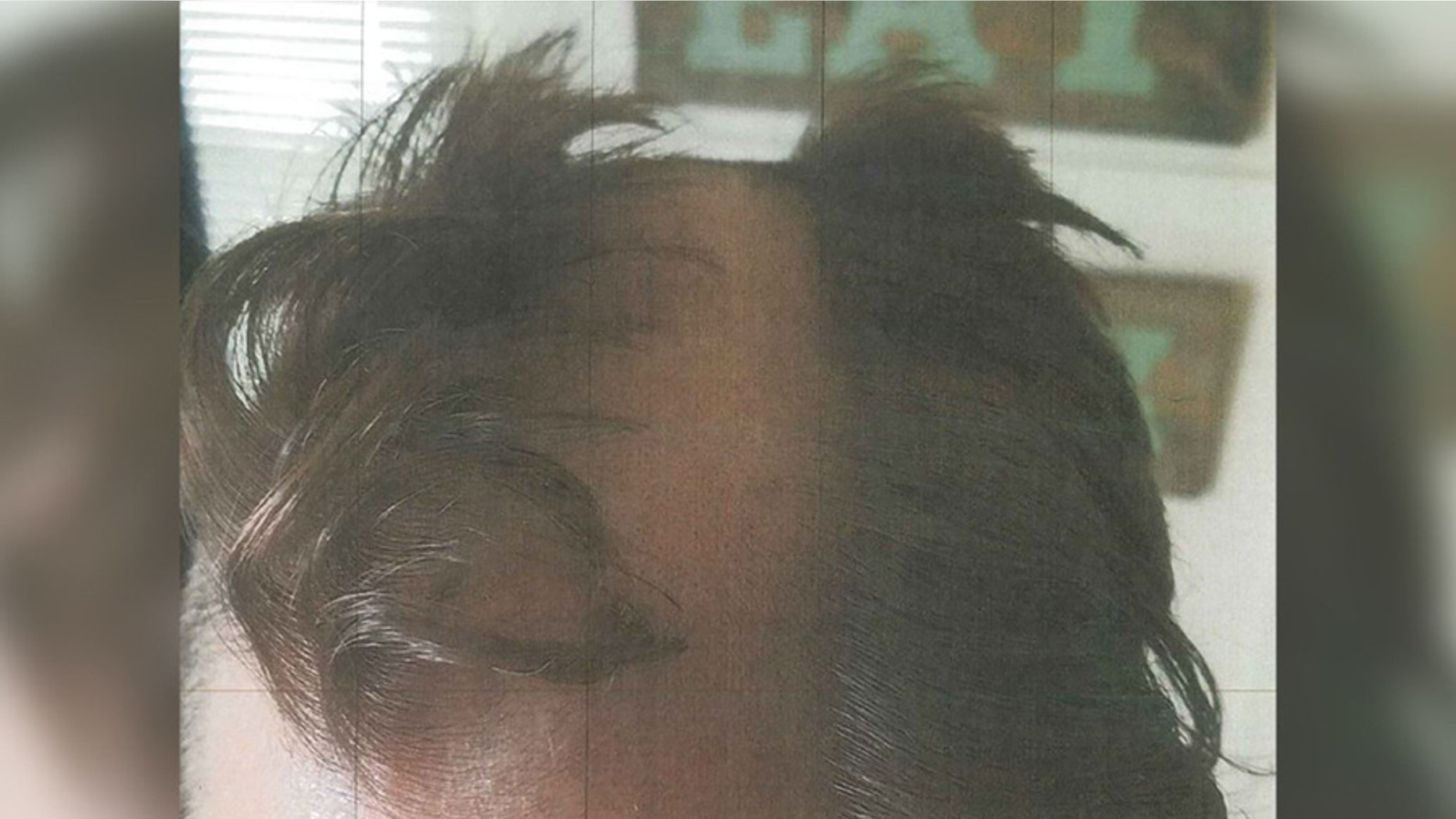 This bad haircut and a wounded ear have left a Wisconsin hairstylist under arrest, authorities said. (Madison Police Department)