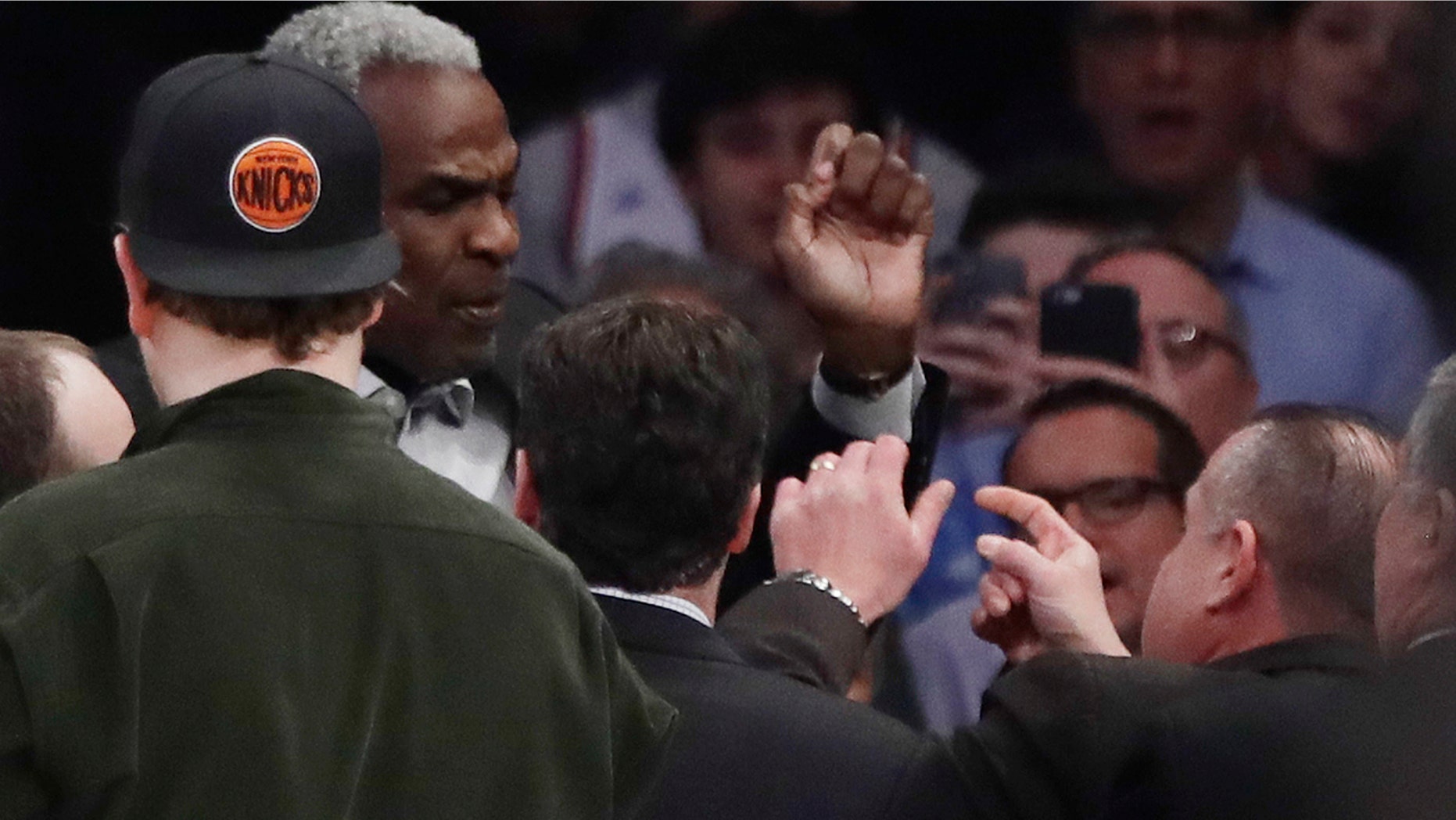 Feb. 8, 2017: Former New York Knicks player Charles Oakley exchanges words with a security guard during the first half of an NBA basketball game between the New York Knicks and the Los Angeles Clippers at Madison Square Garden in New York