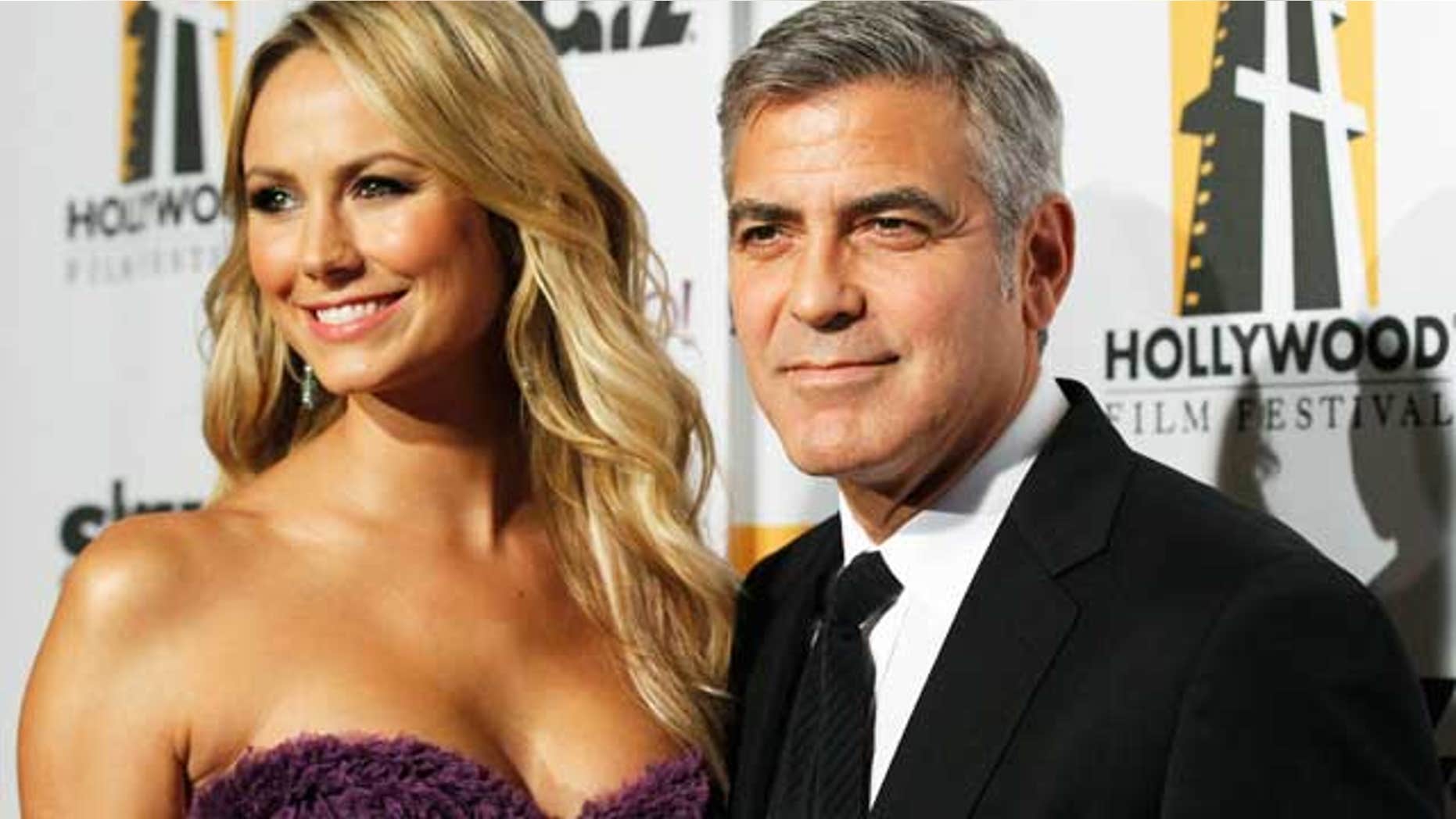 October 25, 2011: George Clooney and Stacy Keibler at the 15th Annual Hollywood Awards Gala in Beverly Hills.