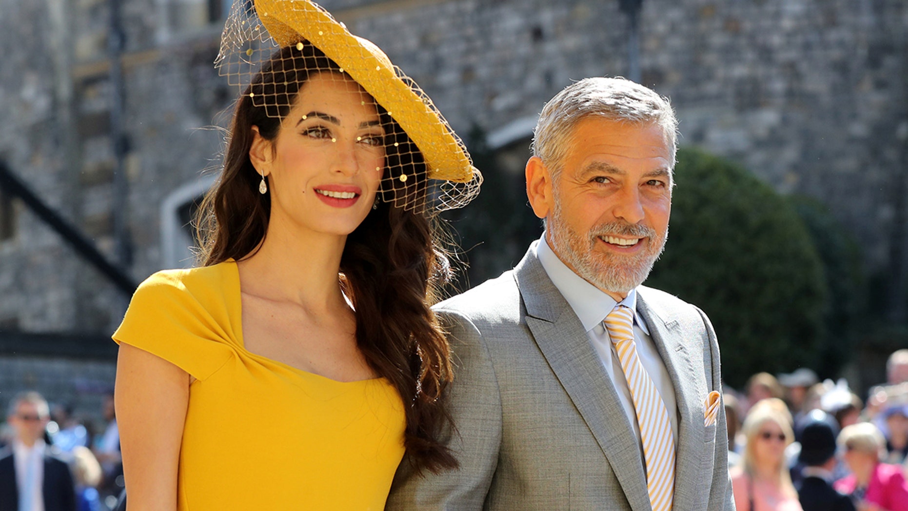 Amal Clooney and George Clooney arrive at St George's Chapel at Windsor Castle for the wedding of Meghan Markle and Prince Harry. Saturday May 19, 2018. Gareth Fuller/Pool via REUTERS - RC1DA1F30DA0