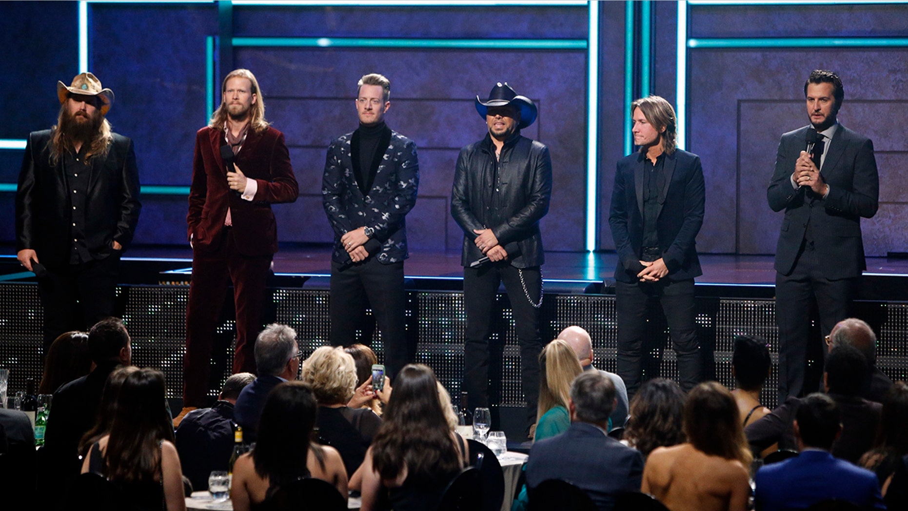 From l to r: Chris Stapelton, Brian Kelly, Tyler Hubbard, Jason Aldean, Keith Urban and Luke Bryan are seen at 2017 CMT Artist of the Year Awards at Nashville's Schermerhorn Symphony Center on Wednesday, Oct. 18, 2017, in Nashville, Tenn.