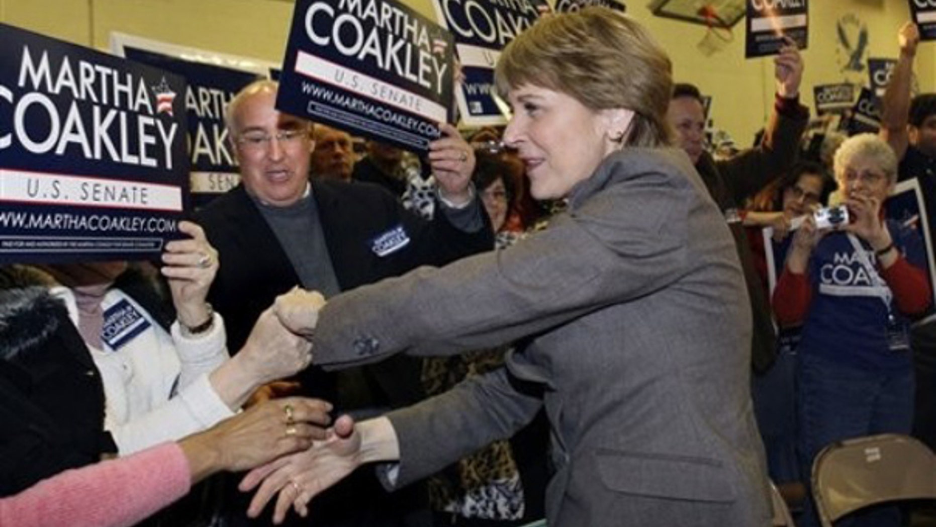 Democrat Martha Coakley shakes hands as she enters a campaign rally in Framingham, Mass., Jan. 18. (AP Photo)