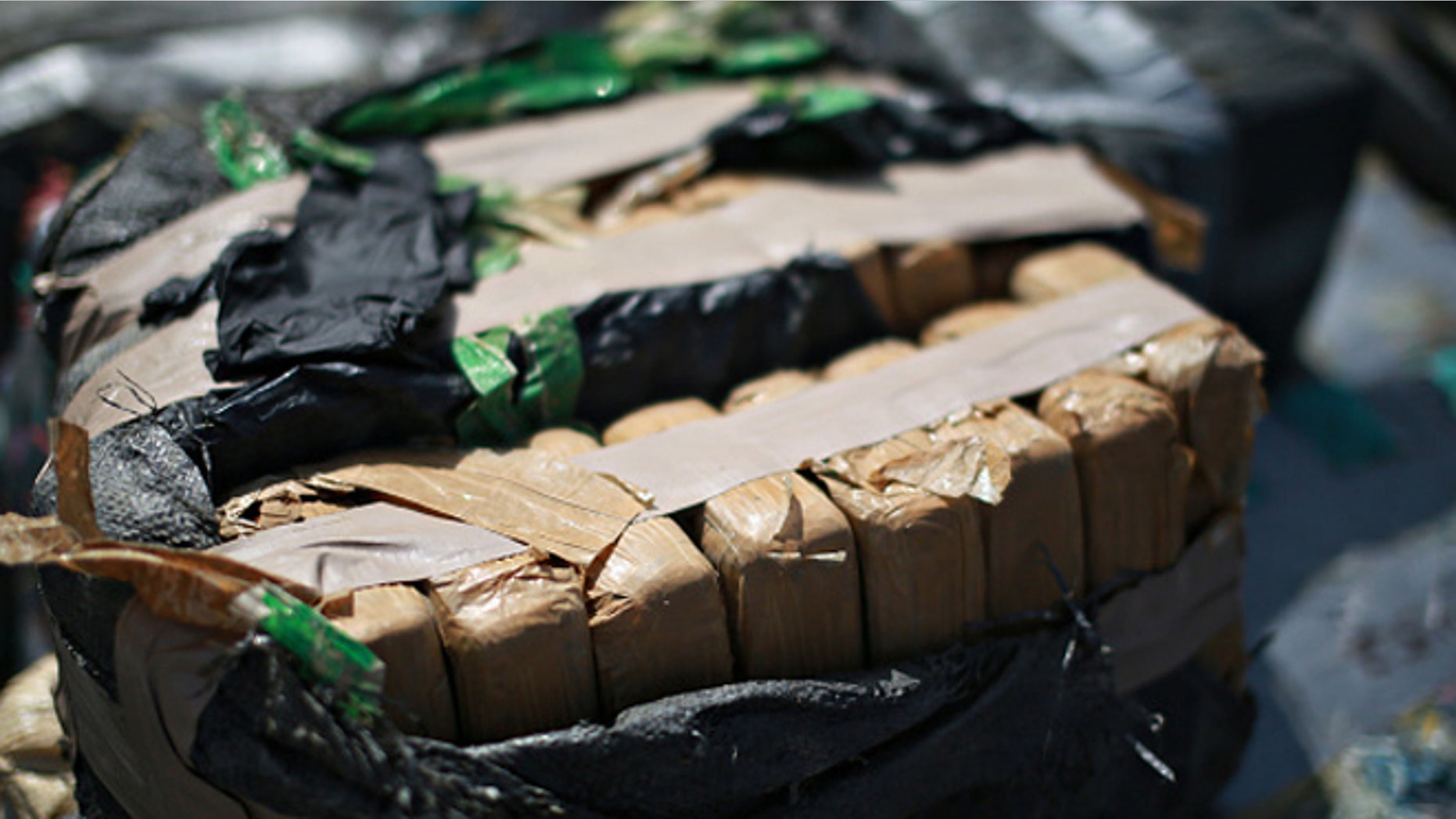 SAN DIEGO, CA - OCTOBER 6: Piles of confiscated cocaine, seized during a 18 different interdictions off the coast of Central and South America, is prepared to be offloaded from aboard the Cutter Boutwell at Naval Base San Diego on October 6, 2014 in San Diego, California. Operation Martillo offloaded more than 28,000 pounds of cocaine with a value of $423 million dollars wholesale. (Photo by Sandy Huffaker/Getty Images)