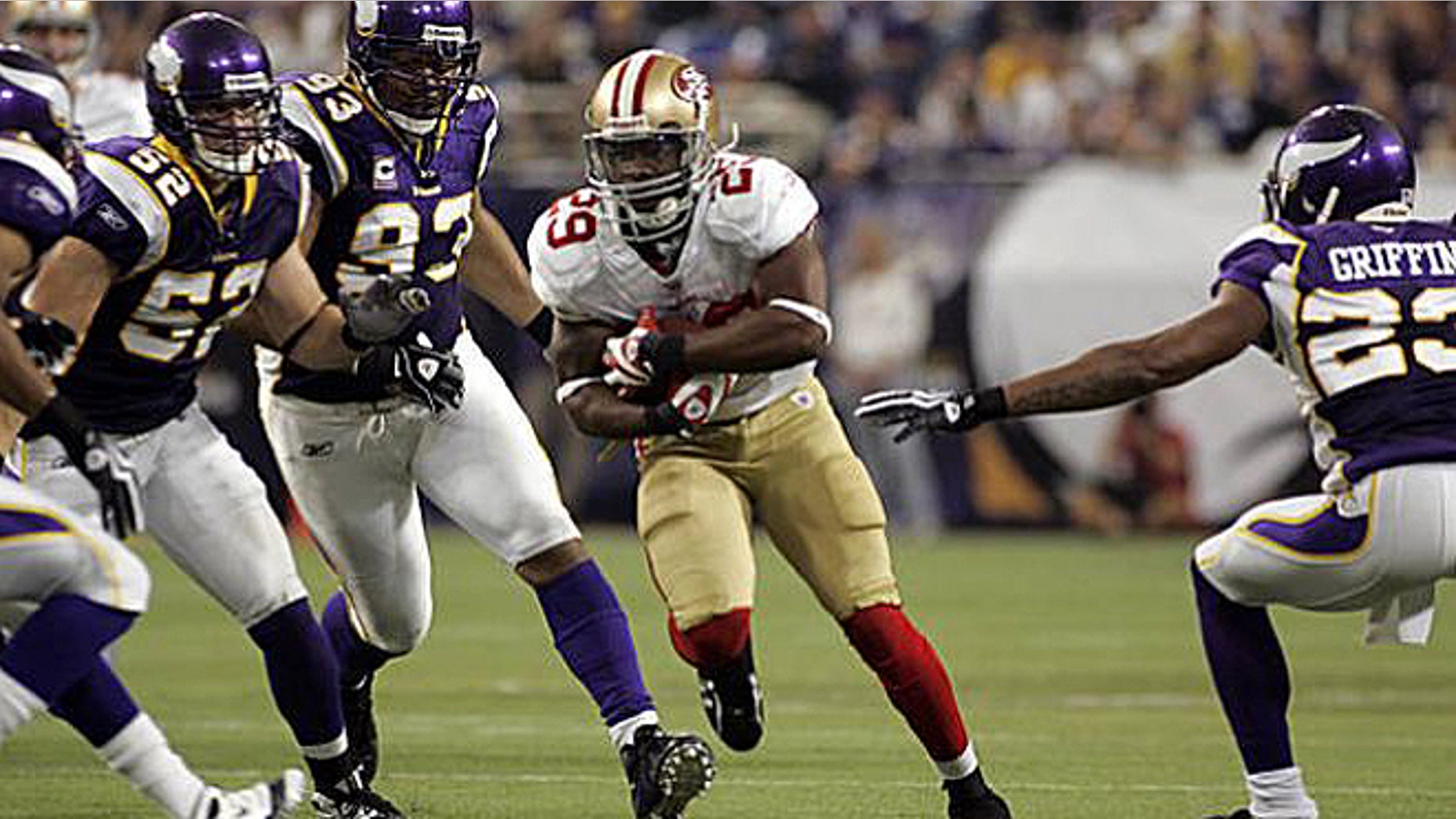 Sept. 27, 2009: San Francisco 49ers' running back Glen Coffee, center, is pursued by Minnesota Vikings' Chad Greenway (52), Kevin Williams (93) and Cedric Griffin (23) on a 21-yard run during the second half of an NFL football game in Minneapolis. Coffee is reportedly set to graduate on Friday from the U.S. Army Airborne School in Georgia. (AP)