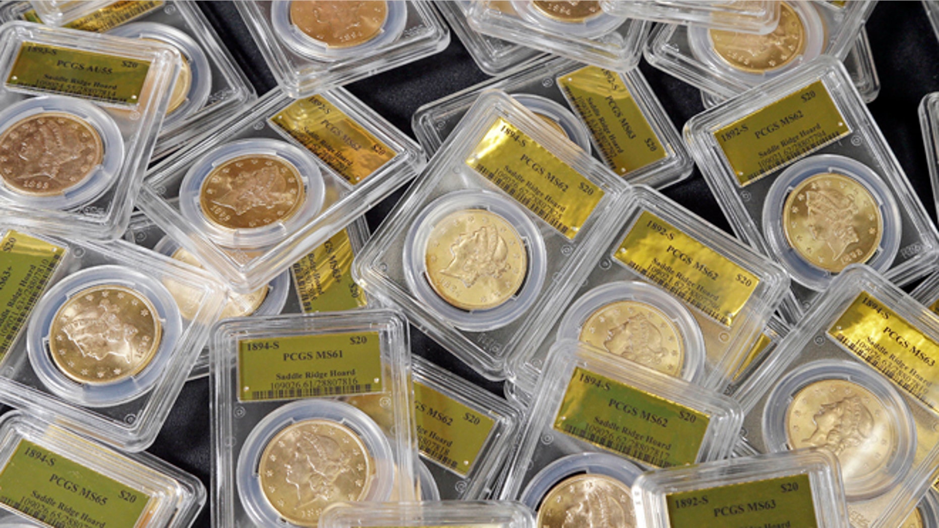 Feb. 25, 2014: This file photo shows some of the 1,427 Gold-Rush era U.S. gold coins displayed at Professional Coin Grading Service in Santa Ana, Calif.