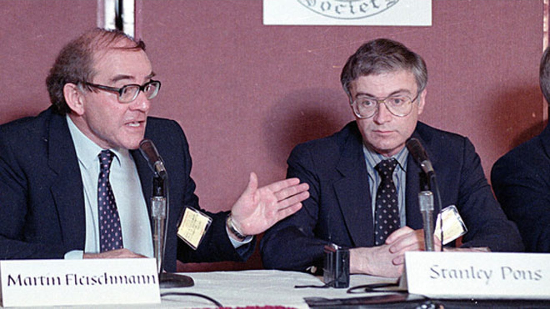 Martin Fleischmann, left, of the University of Southampton, England, talks to reporters about cold fusion as University of Utah chemist B. Stanley Pons listens, in Los Angeles, May 9, 1989. The pair of scientists claimed they have achieved nuclear fusion at room temperature.