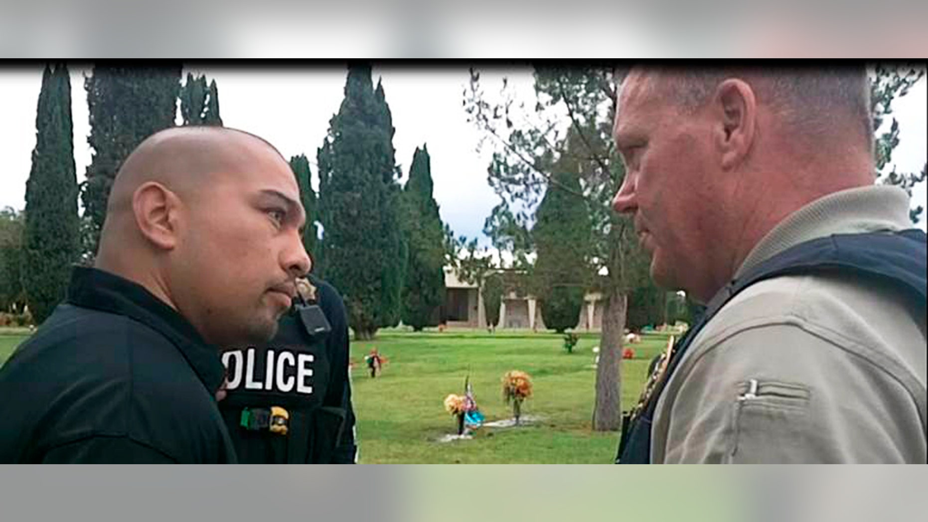 This Sept. 16, 2014 photo provided by the Cottonwwood, Ariz., Police Department shows Cecilio Cruz, left, and Cottonwood, Ariz., police Sgt. Tod Moore at a funeral home and cemetery in Tucson, Ariz., on Tuesday, Sept. 16, 2014.