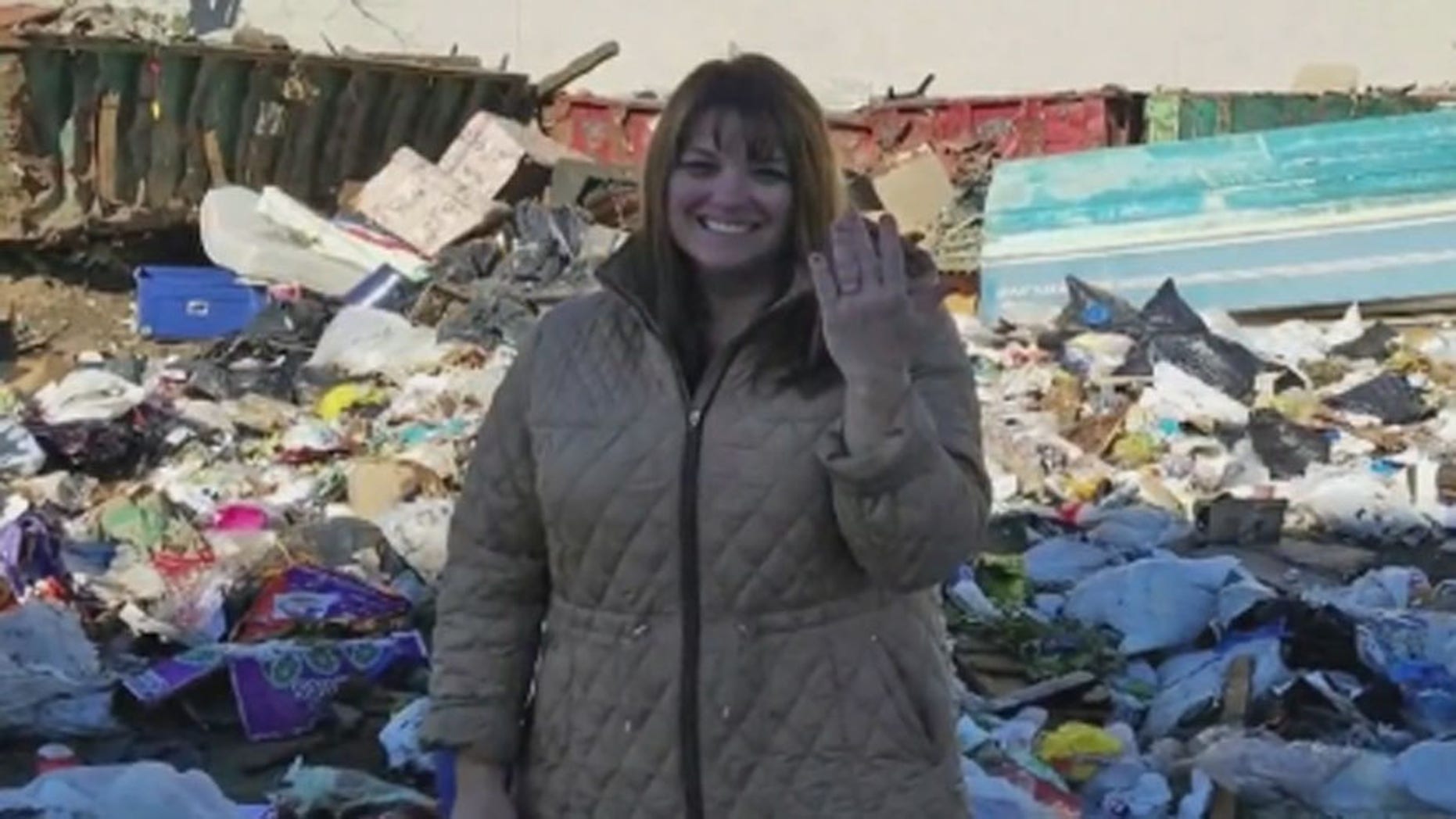 Colleen Dyckman, of Long Island, with the rings she accidentally tossed in the trash. (CBS New York)