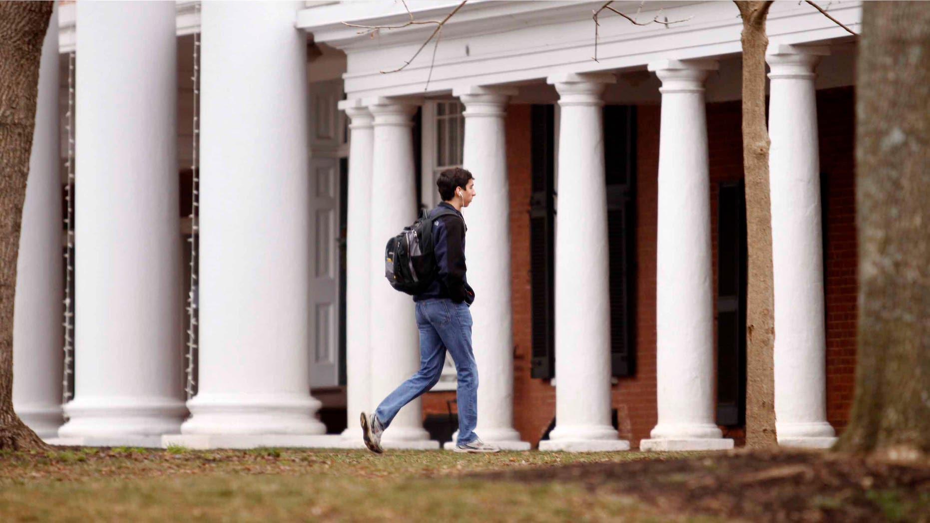 CHARLOTTESVILLE, VA - DECEMBER 6: Garrett Durig, a fourth year student at the University of Virginia, walks across campus on December 6, 2014 in Charlottesville, Virginia. On Friday, Rolling Stone magazine issued an apology for discrepencies that were published in an article regarding the alleged gang rape of a University of Virginia student by members of the Phi Kappa Psi fraternity. (Photo by Jay Paul/Getty Images)