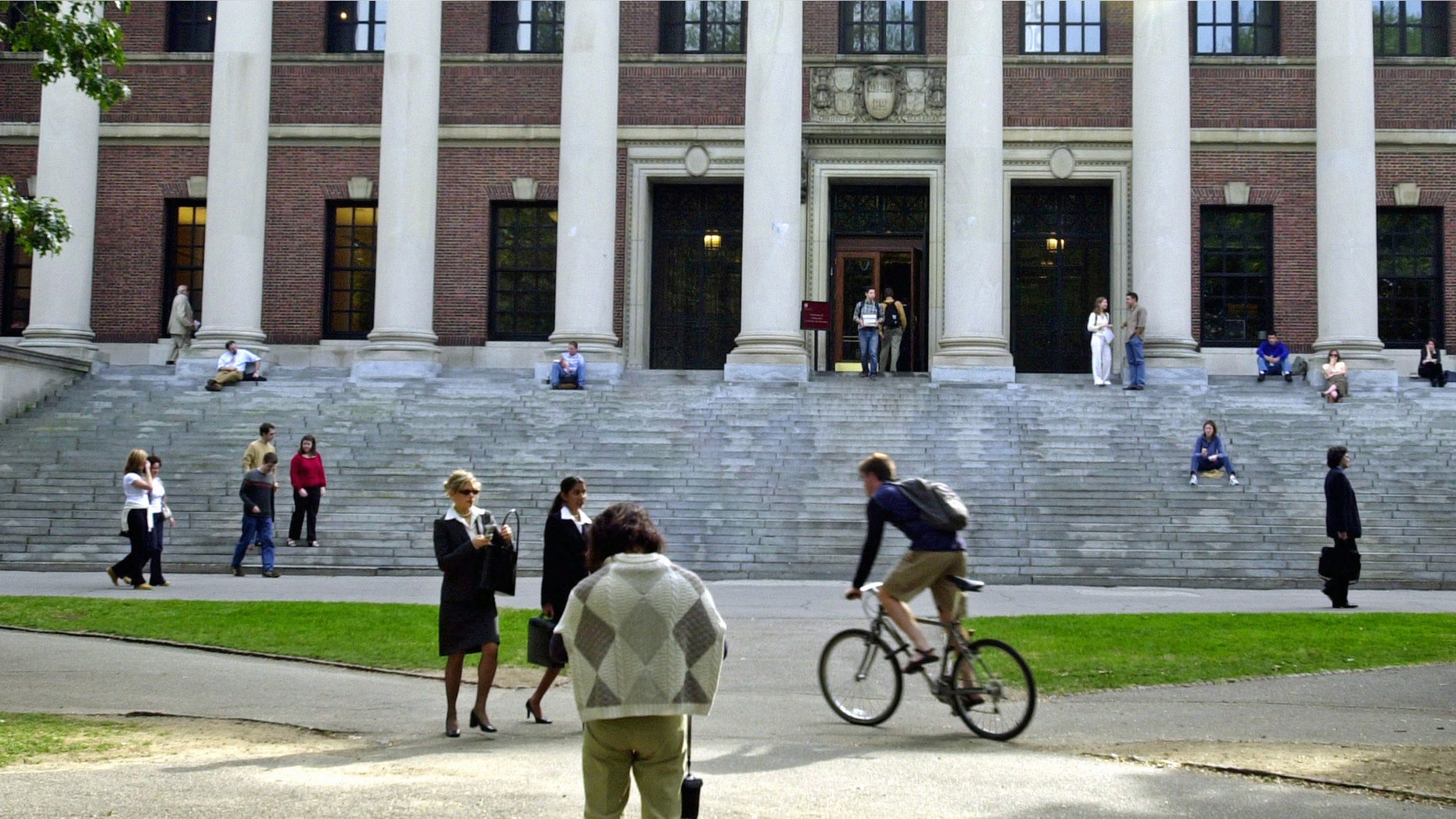 CAMBRIDGE, MA - OCTOBER 10: Students pass in front of Harvard's Widener Library on October 10, 2003 in Cambridge, Massachusetts. (Photo by William B. Plowman/Getty Images)