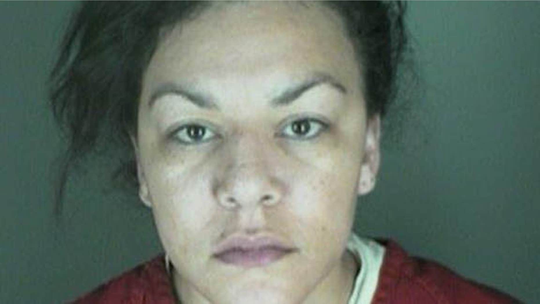 In this undated file photo, provided by the Longmont Police Department shows Dynel Lane, 34, who is accused of stabbing a pregnant woman in the stomach and removing her baby, while the expectant mother visited her home to buy baby clothes advertised on Craigslist authorities said.