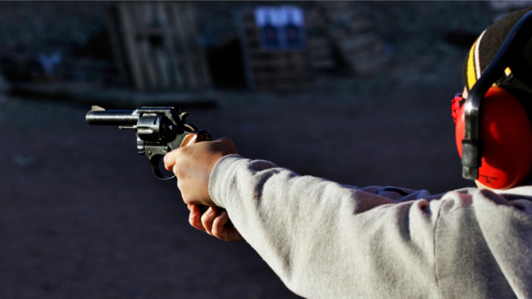 Dec. 23, 2012: A man shoots a revolver, at Dragonman's firing range and gun dealer, outside Colorado Springs, Colo.