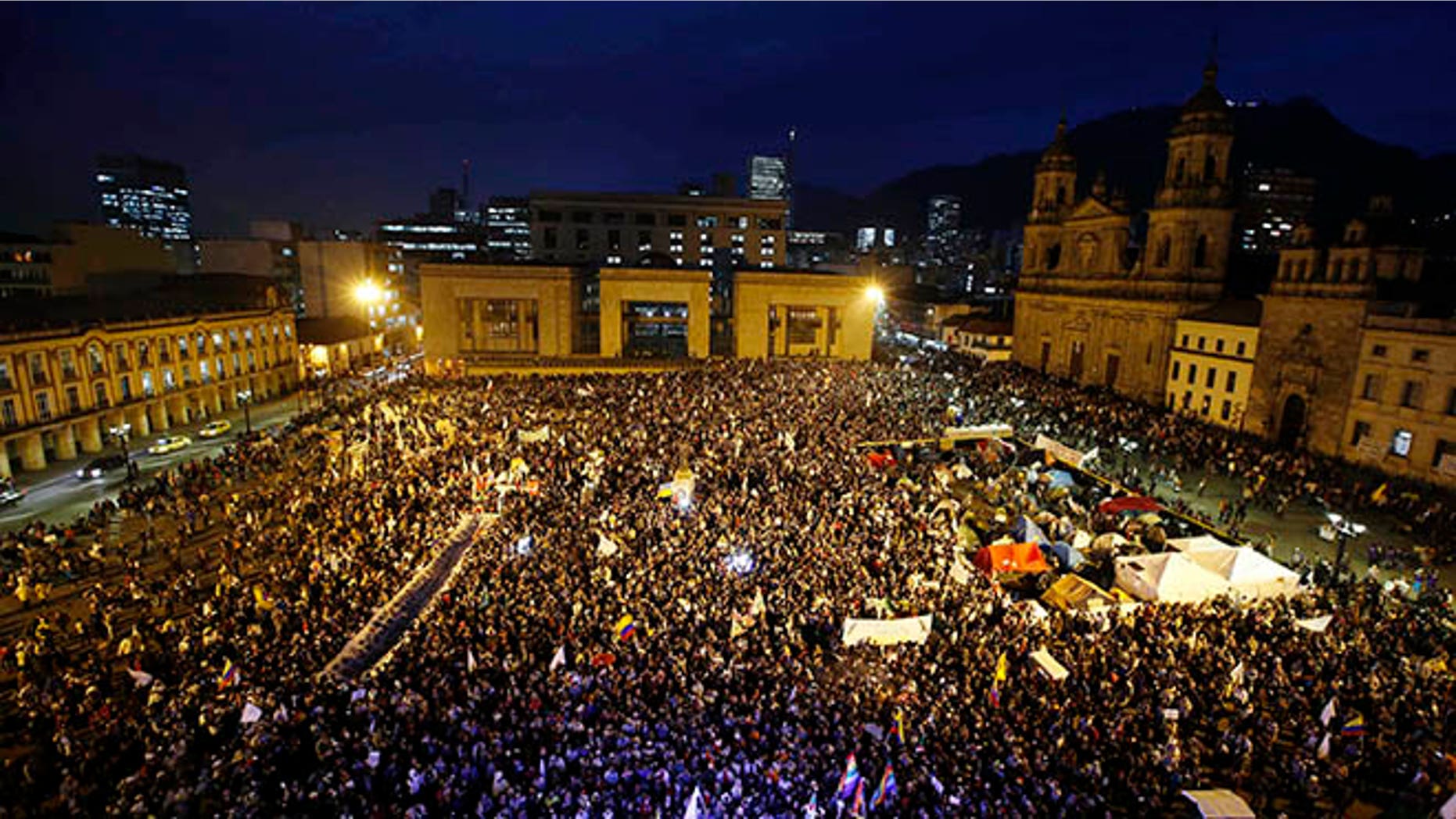 People gather at Bolívar square during a peace march in Bogotá, Colombia, Wednesday, Oct. 12, 2016.