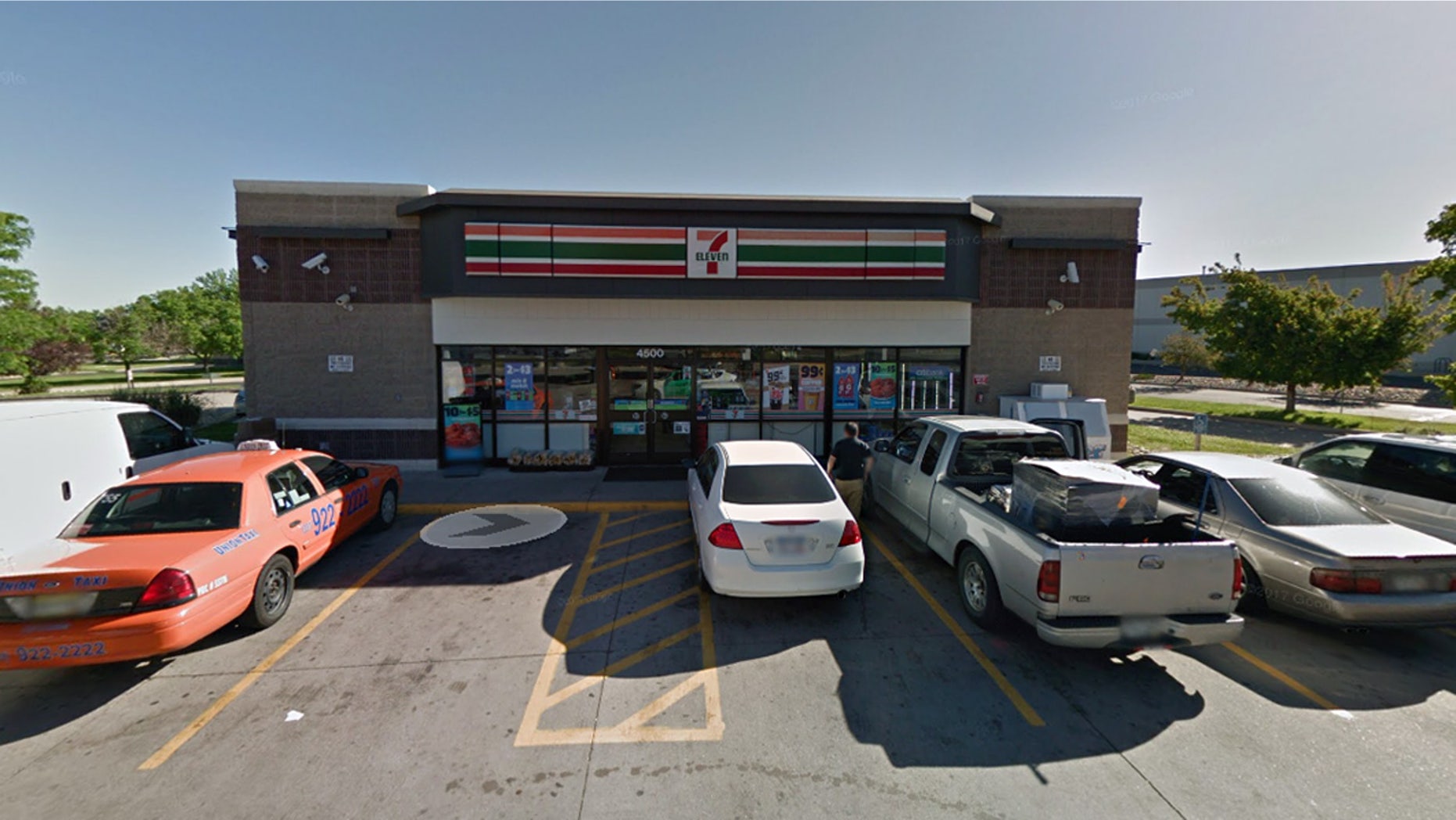 The corrections workers were discovered kissing each other in the parking lot of this 7-Eleven in Denver.