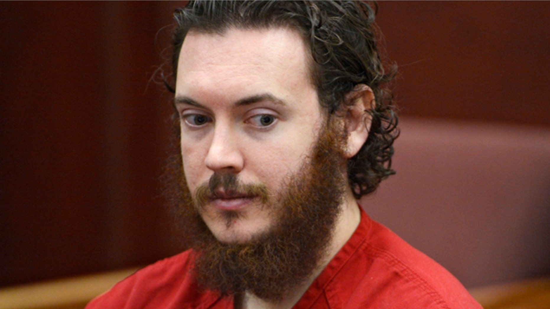 June 4, 2013: File photo, Aurora theater shooting suspect James Holmes is seated in court in Centennial, Colo.