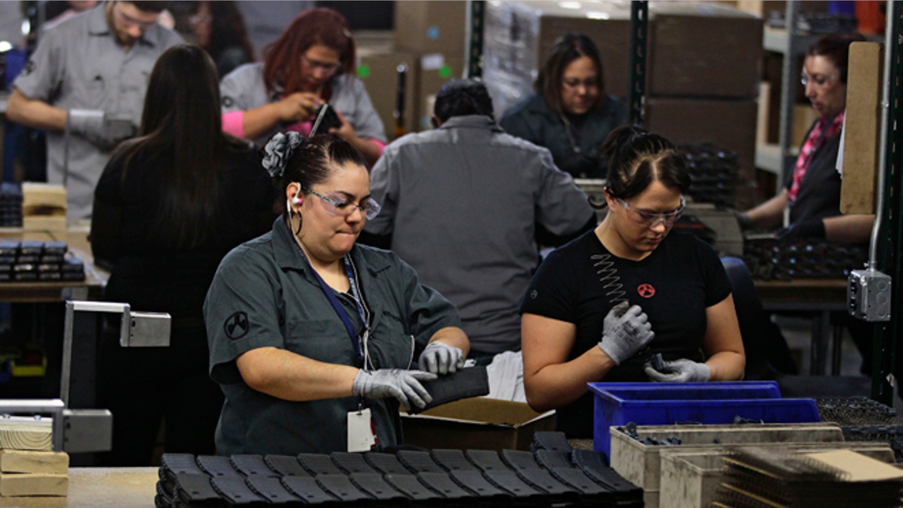 Feb. 28, 2013: In this photo, workers assemble 30-round capacity ammunition magazines for high-velocity rifles, inside the Magpul Industries plant in Erie, Colo.