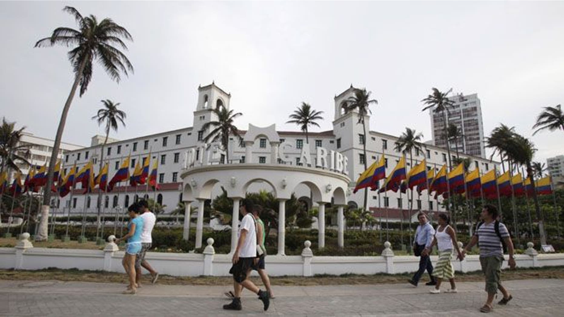 April 14, 2012: People walk past Hotel El Caribe in Cartagena, Colombia.