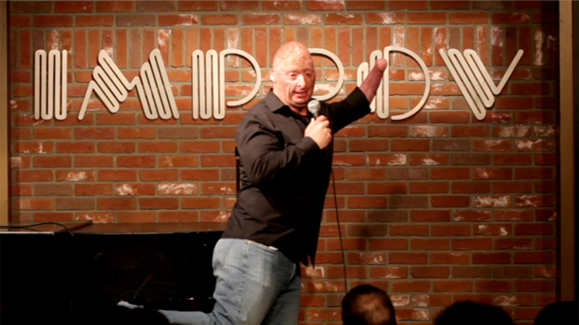Wounded veteran Bobby Henline performs stand-up comedy.