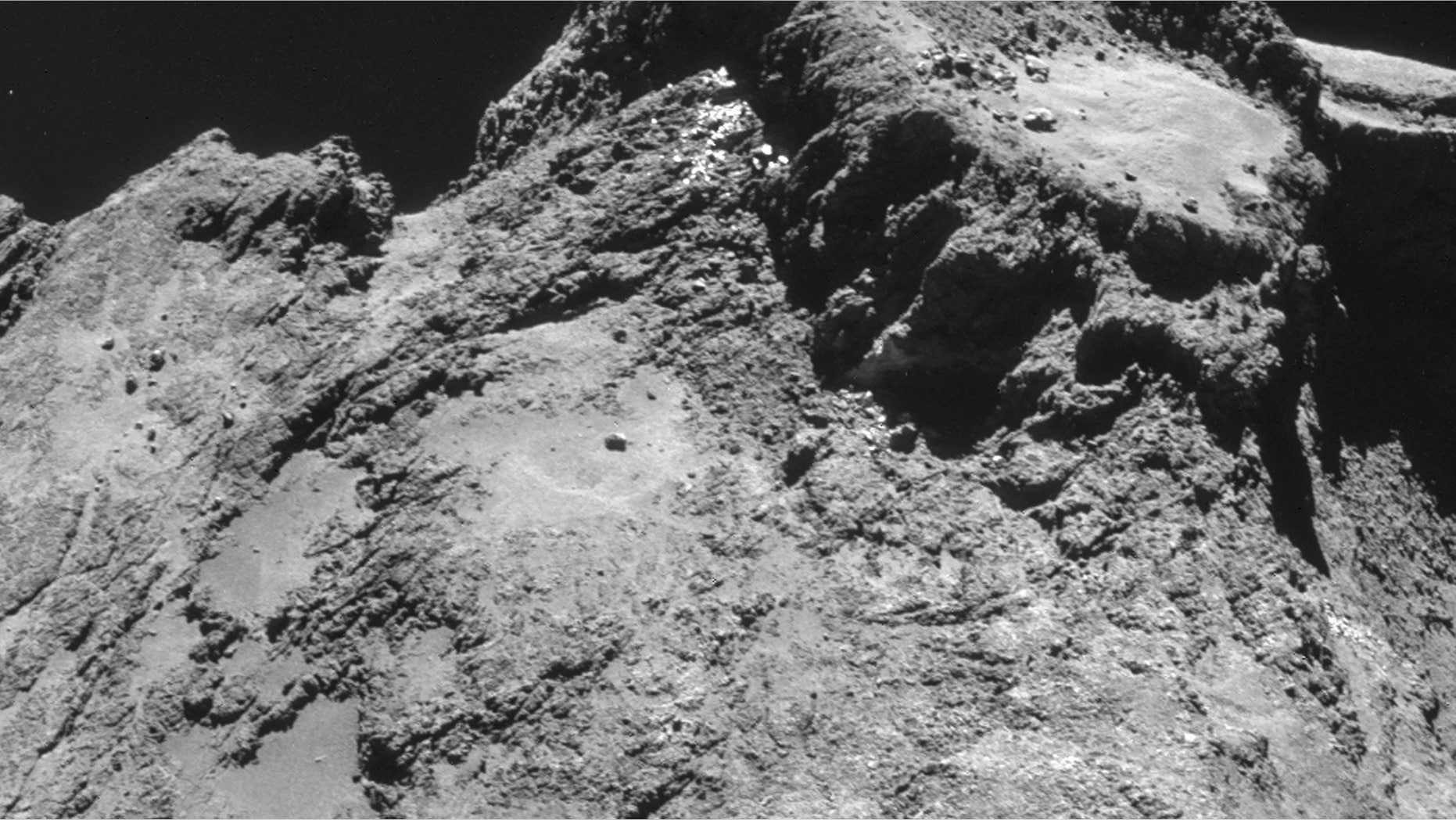 Oct. 24, 2014: The picture taken with the navigation camera on Rosetta and released by the European Space Agency ESA shows a raised plateau on the larger lobe of Comet 67P/Churyumov–Gerasimenko.