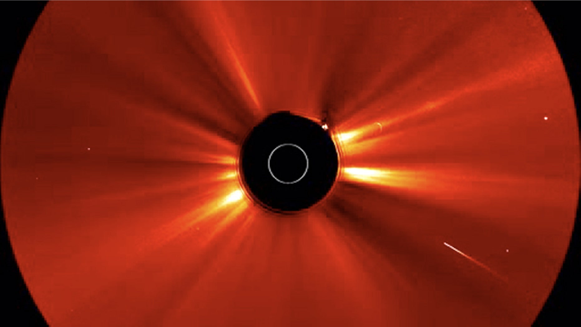 Soon after a huge solar storm erupted on May 20-21, 2011, a comet (bright streak at lower right) plunged into the sun. This shot is a still from a video taken by one of NASA's twin STEREO spacecraft.