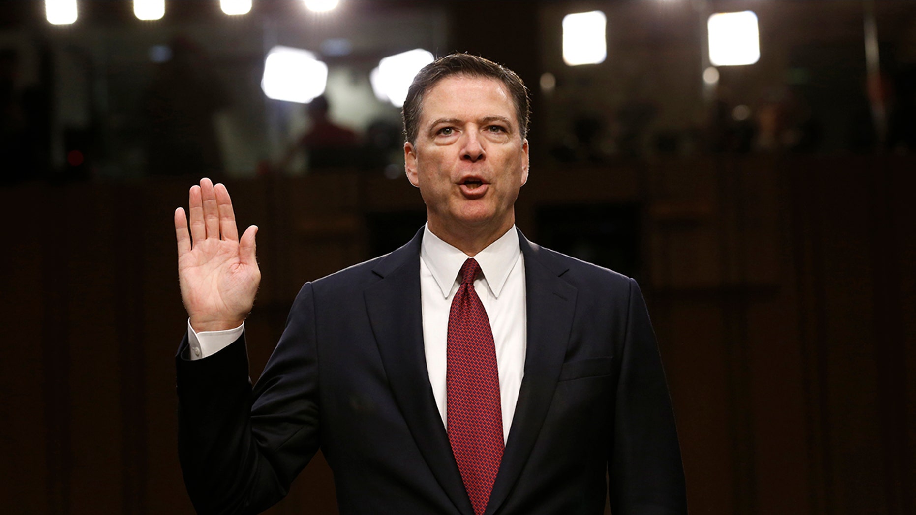 File photo - Former FBI Director James Comey is sworn in prior to testifying before a Senate Intelligence Committee hearing on Russia's alleged interference in the 2016 U.S. presidential election on Capitol Hill in Washington, U.S., June 8, 2017. (REUTERS/Jonathan Ernst)