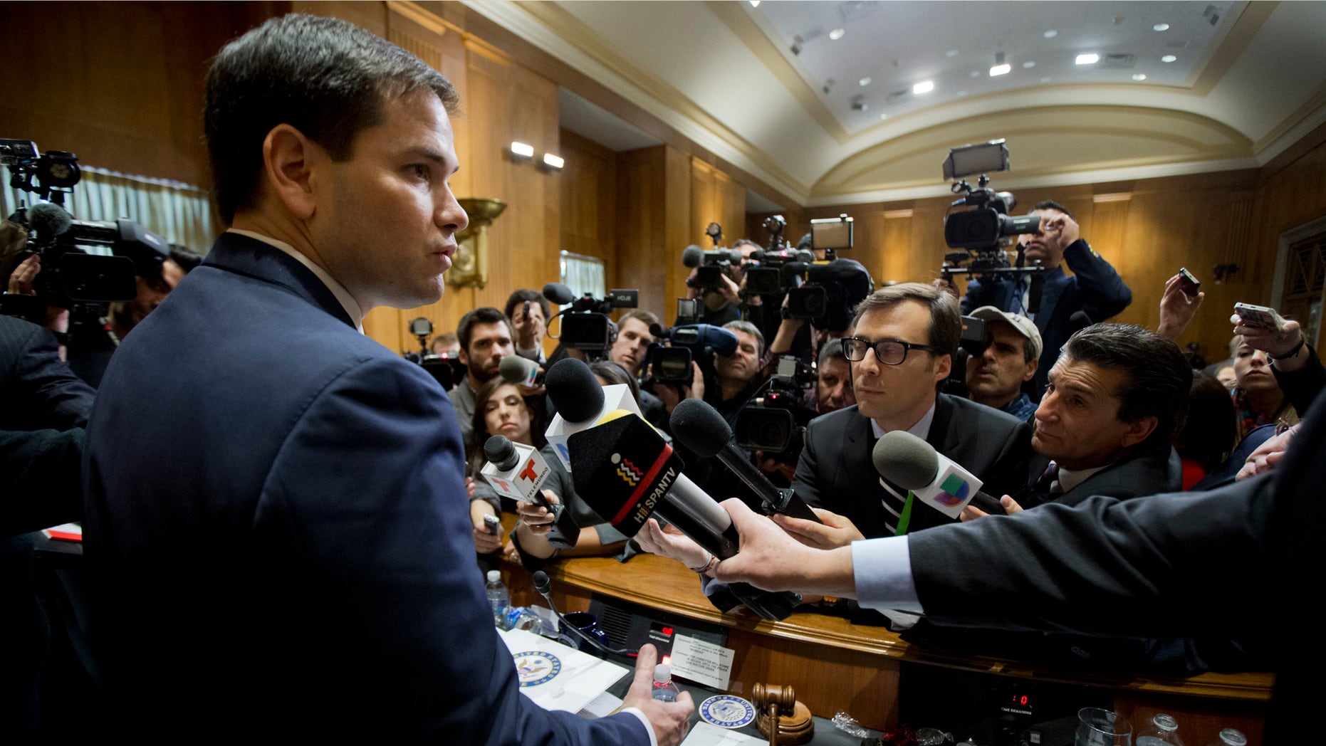 Sen. Marco Rubio speaks to reporters following a hearing on Cuba on Capitol Hill Tuesday, Feb. 3, 2015.