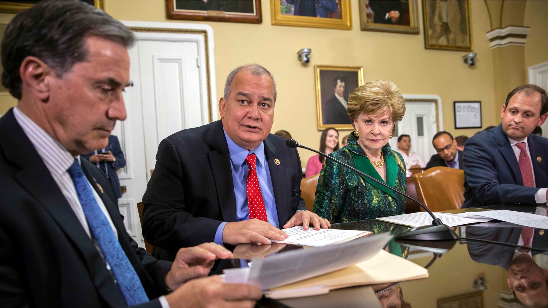 Rep. Gary Palmer, R-Ala., Del. Gregorio Kilili Camacho Sablan, D-Northern Mariana Islands, Del. Madeleine Bordallo, D-Guam, and Rep. Andy Barr, R-Ky., go before the House Rules Committee to prepare a bill for floor debate that would create a financial control board for Puerto Rico and restructure some of the U.S. territory's $70 billion debt, at the Capitol in Washington, Wednesday, June 8, 2016.