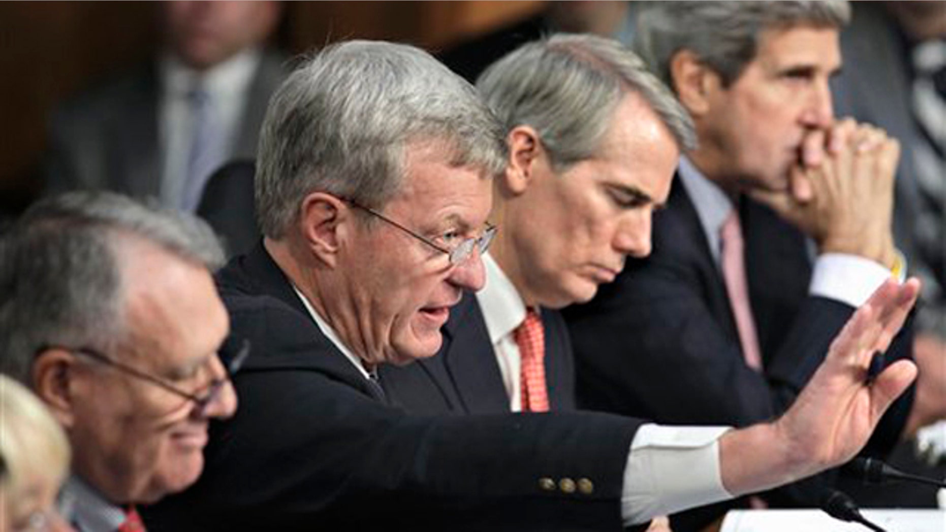Oct. 26, 2011: Members of the deficit Super Committee meet on Capitol Hill. From left are Sen. Jon Kyl, Sen. Max Baucus, Sen. Rob Portman, and Sen. John Kerry.