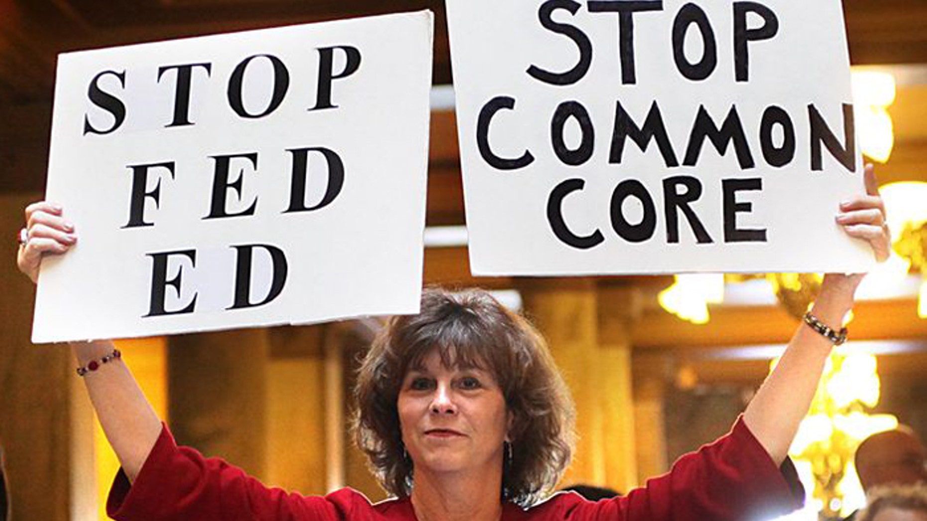 An opponent protests Common Core State Standards in Indianapolis. Indiana was the first state to back out of the national education standard. (AP)