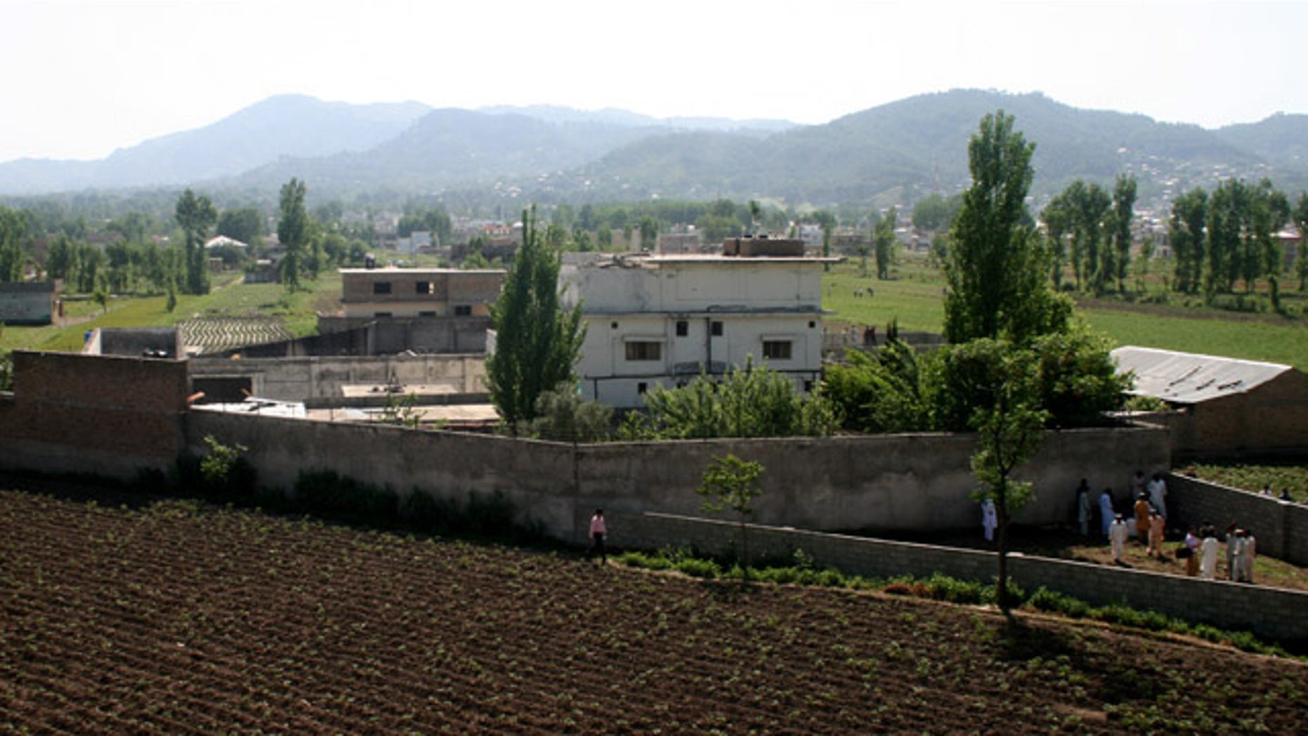 A view of Osama bin Laden's compound in Abbottabad, Pakistan, on Tuesday, May 3, 2011, after a U.S. military raid late Monday which ended with the death of the al-Qaida leader Osama bin Laden and others inside the compound. U.S. Navy SEALs swept through the massive compound Monday in pursuit of their target, bin Laden, and it is revealed Tuesday by White House counterterrorism adviser John Brennan that the U.S. already was scouring through items seized in the raid, said to include hard drives, DVD's, a pile of documents and other items. (AP Photo/Aqeel Ahmed)