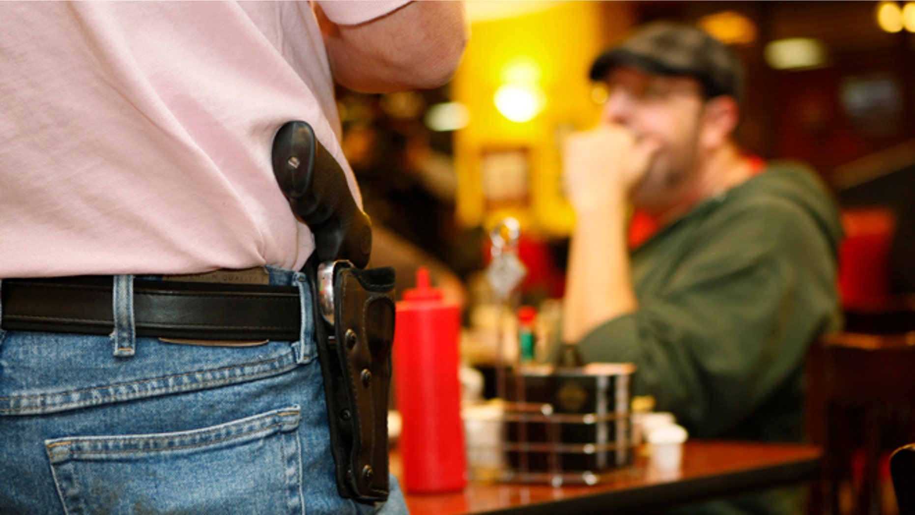 Nov. 1, 2012: A Oklahoma resident wears an unconcealed side arm.