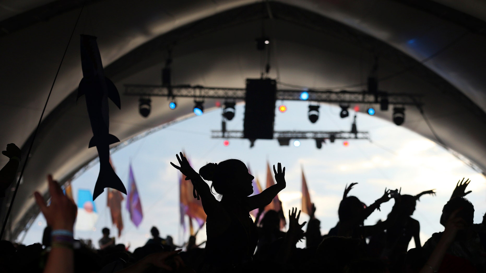 Festival goers dance during the Glastonbury Festival June 28, 2014.