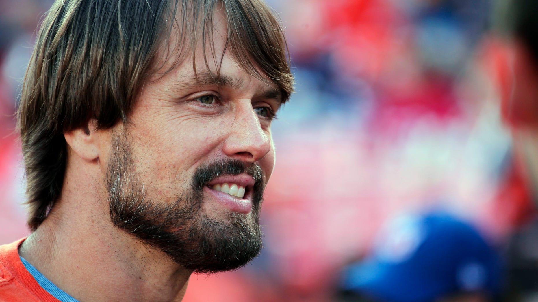 FILE - In this Nov. 15, 2015, file photo, former Denver Broncos quarterback Jake Plummer smiles on the sidelines during an NFL football game between the Broncos and the Kansas City Chiefs in Denver. If a compound found in hemp _ and its notorious cousin, cannabis _ proves as effective in treating brain injuries as testimonials claim, it would also be welcome news for the NFL on concussions, and even better for players. Along with a handful of other retired players, Plummer felt strongly enough about the benefits to appear in a public-service campaign titled When the Bright Lights Fade. (AP Photo/Jack Dempsey, File)