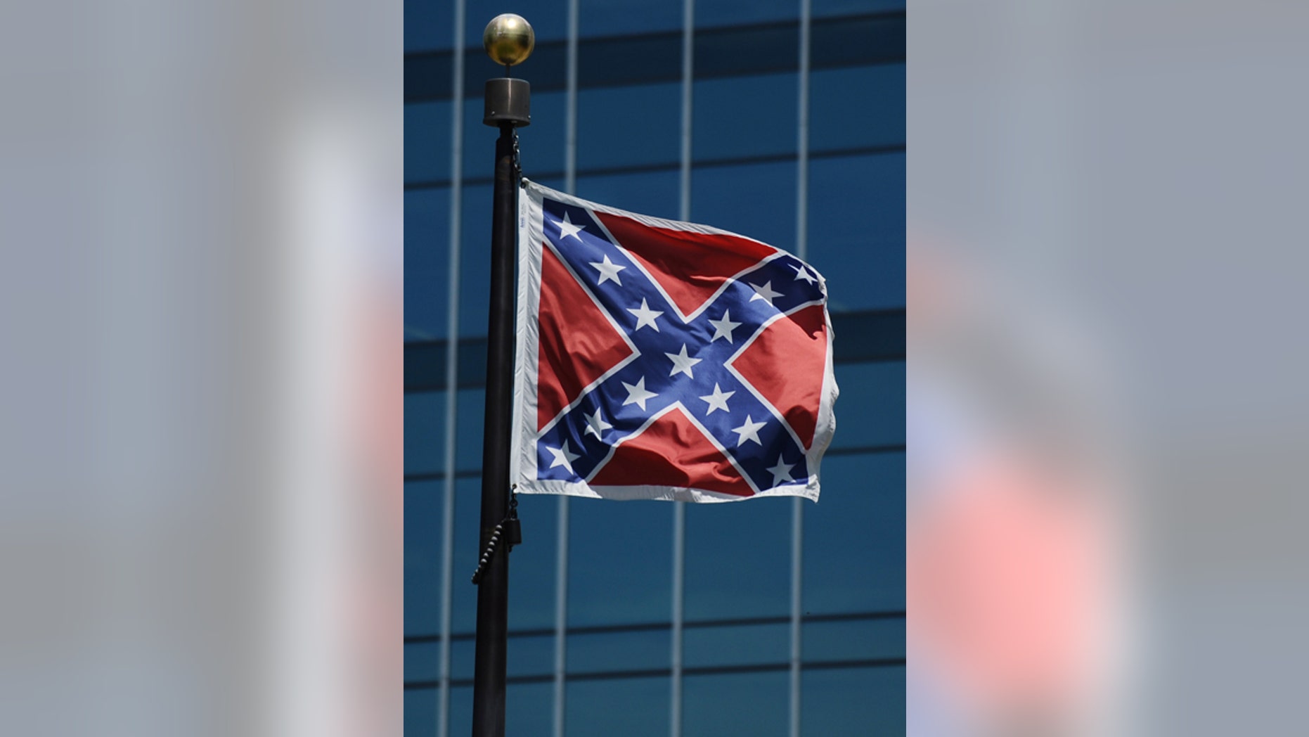 The Confederate flag flies near the South Carolina Statehouse, Friday, June 19, 2015, in Columbia, S.C. Tensions over the Confederate flag flying in the shadow of South Carolina’s Capitol rose this week in the wake of the killings of nine people at a black church in Charleston, S.C. (AP Photo/Rainier Ehrhardt)