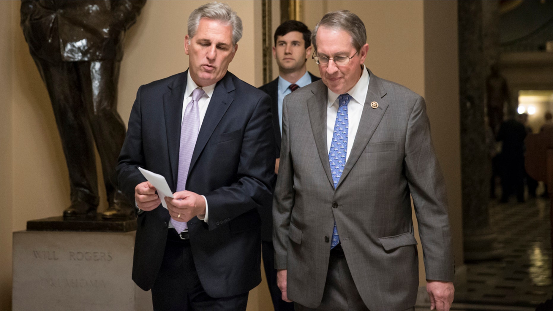 House Majority Leader Kevin McCarthy, R-Calif., left, and House Judiciary Committee Chairman Bob Goodlatte, R-Va., walk to the chamber as the House votes on a rewrite of the No Child Left Behind law that rolls back the federal control in American education and returns authority to the states on how to improves schools and evaluate teachers, on Capitol Hill in Washington, Wednesday, Dec. 2, 2015. (AP Photo/J. Scott Applewhite)