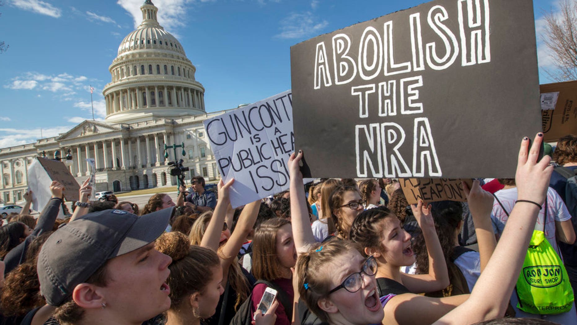 CORRECTS TO MARJORY STONEMAN DOUGLAS HIGH SCHOOL, NOT PARKLAND - In this Feb. 21, 2018, photo, school students from Montgomery County, Md., in suburban Washington, rally in solidarity with those affected by the shooting at Marjory Stoneman Douglas High School in Florida, at the Capitol in Washington. Member of Congress return from a 10-day recess under enormous pressure to respond to gun violence after the Parkland high school shooting. Despite a long list of legislative proposals, including many flowing from President Donald Trump, few ideas seem poised for passage. (AP Photo/J. Scott Applewhite, File)