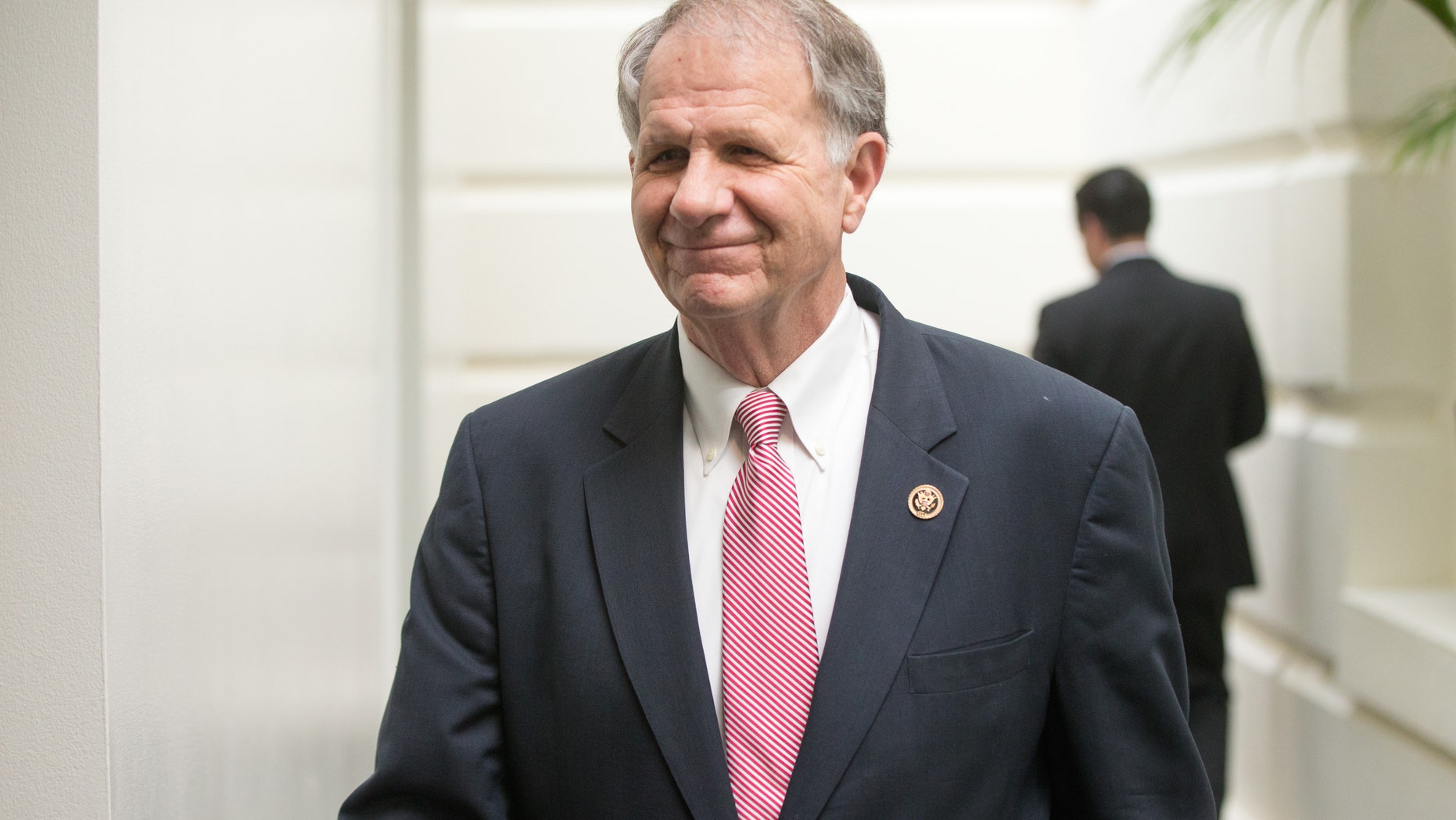 Rep. Ted Poe walks to a GOP meeting on Capitol Hill in December.