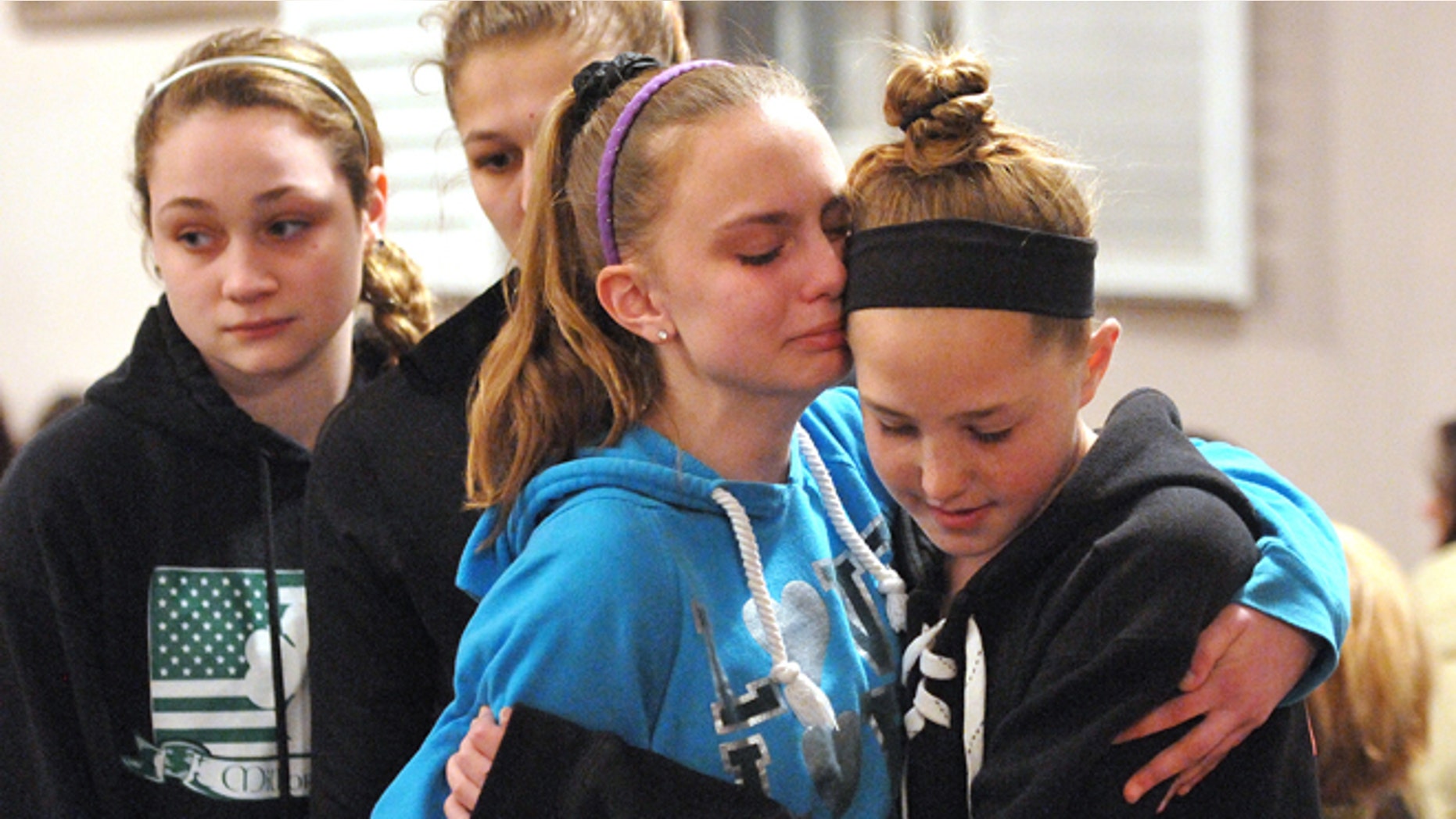 April 25, 2014: Friends and family including many students from Jonathan Law High School attend a memorial service at the First United Church of Christ in Milford, Conn., for Maren Sanchez who was killed at the school.