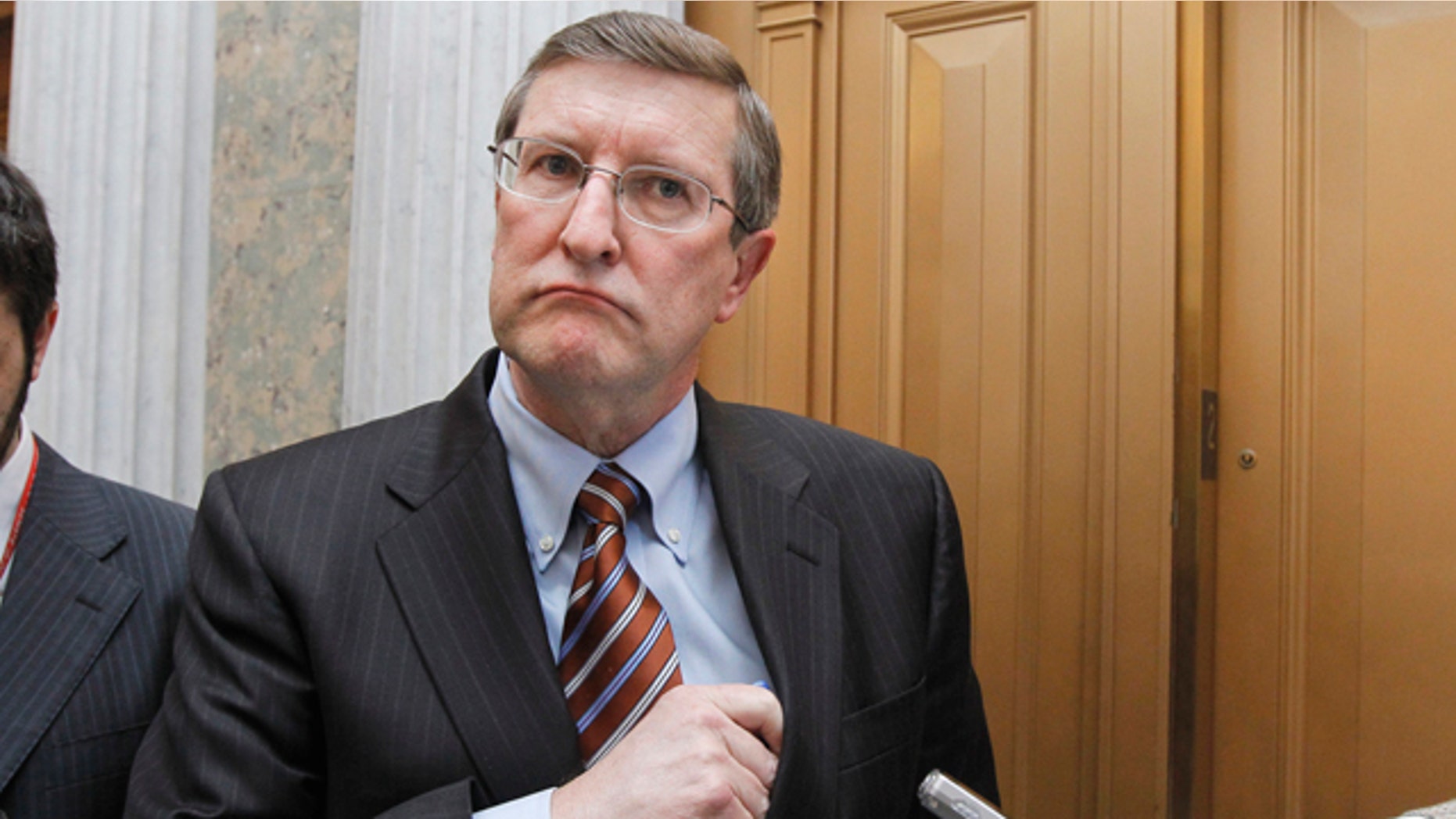 Senate Budget Committee Chairman Sen. Kent Conrad, D-N.D., talks to reporters on Capitol Hill