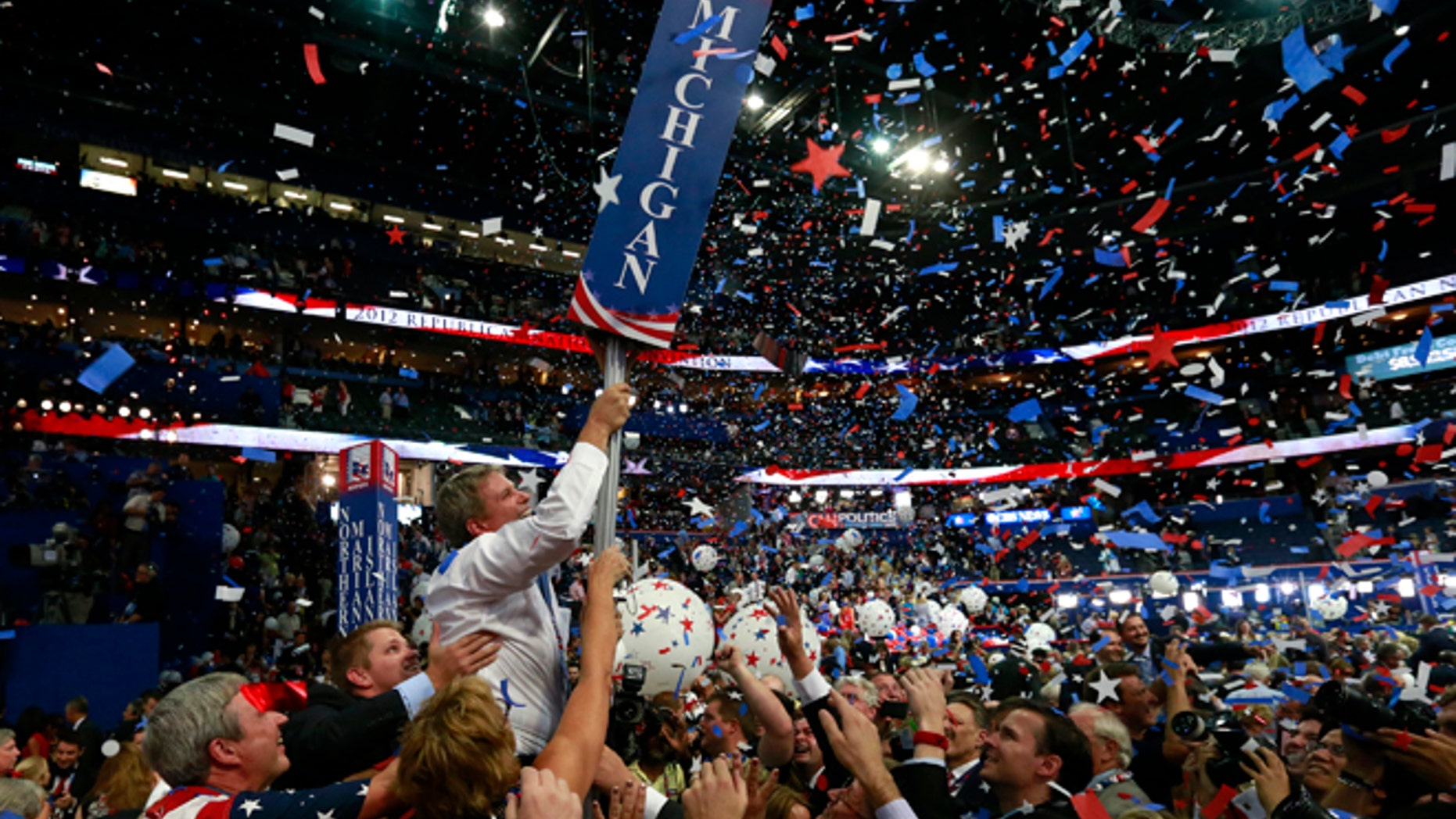 In this Aug. 30, 2012, file photo, Michigan delegates celebrate after Mitt Romney accepts the nomination at the Republican National Convention in Tampa, Florida. (REUTERS)