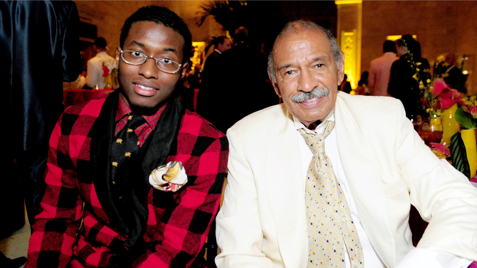 In this July 16, 2011 photo, John Conyers, III poses with his father Rep. John Conyers, D-Mich., in Detroit. John Conyers' resignation from the U.S. House amid sexual harassment allegations unlocks the seat he's held for more than a half-century. The 88-year-old endorsed his son, political neophyte John Conyers III. (Ricardo Thomas /Detroit News via AP)