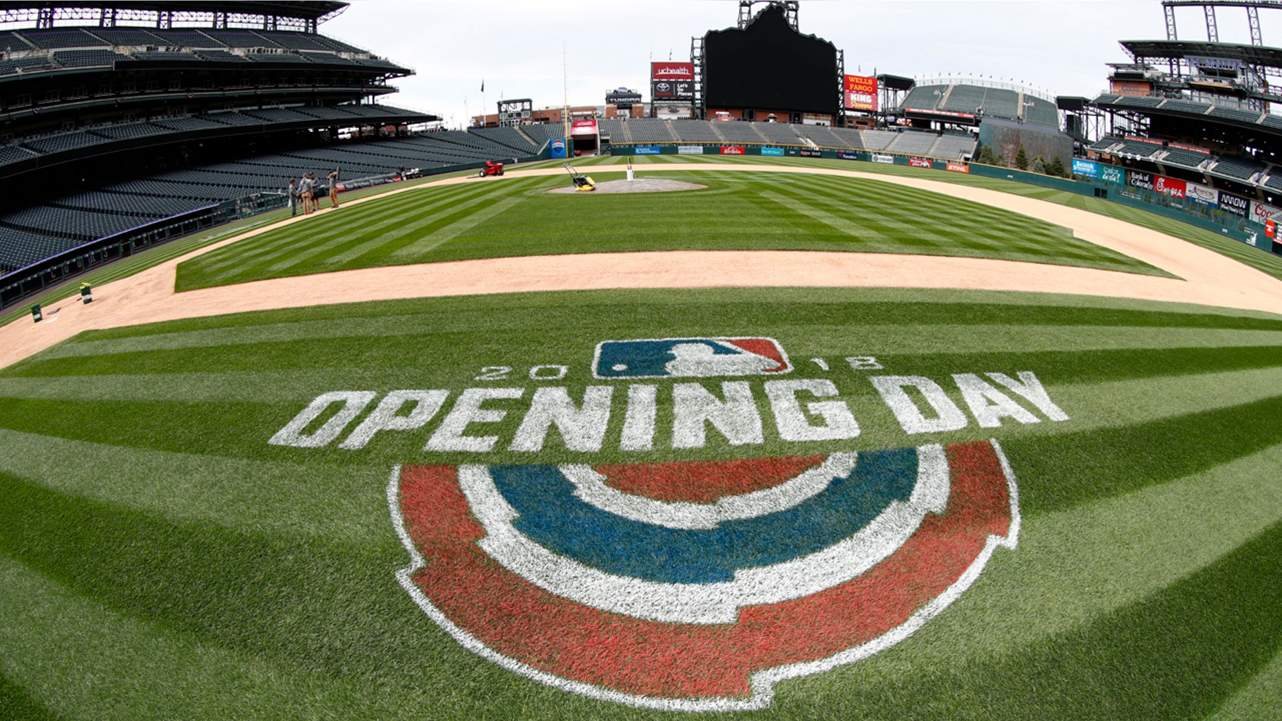 Coors Field in Denver (really) is seen as grounds crew members prepare the ballpark for the Colorado Rockies' home opener, April 5, 2018.