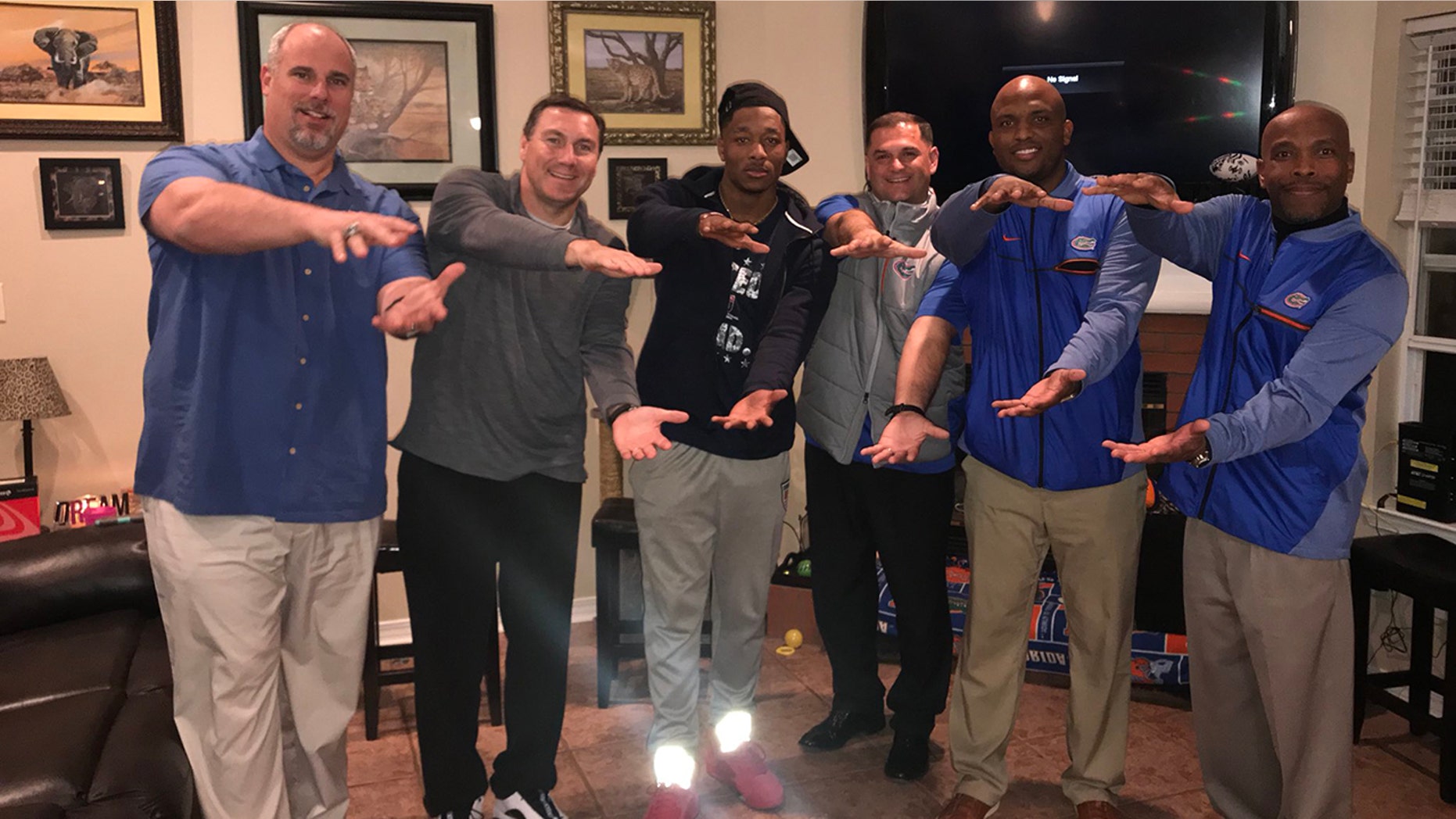 Jacob Copeland, center, pictured with the Florida Gators staff.