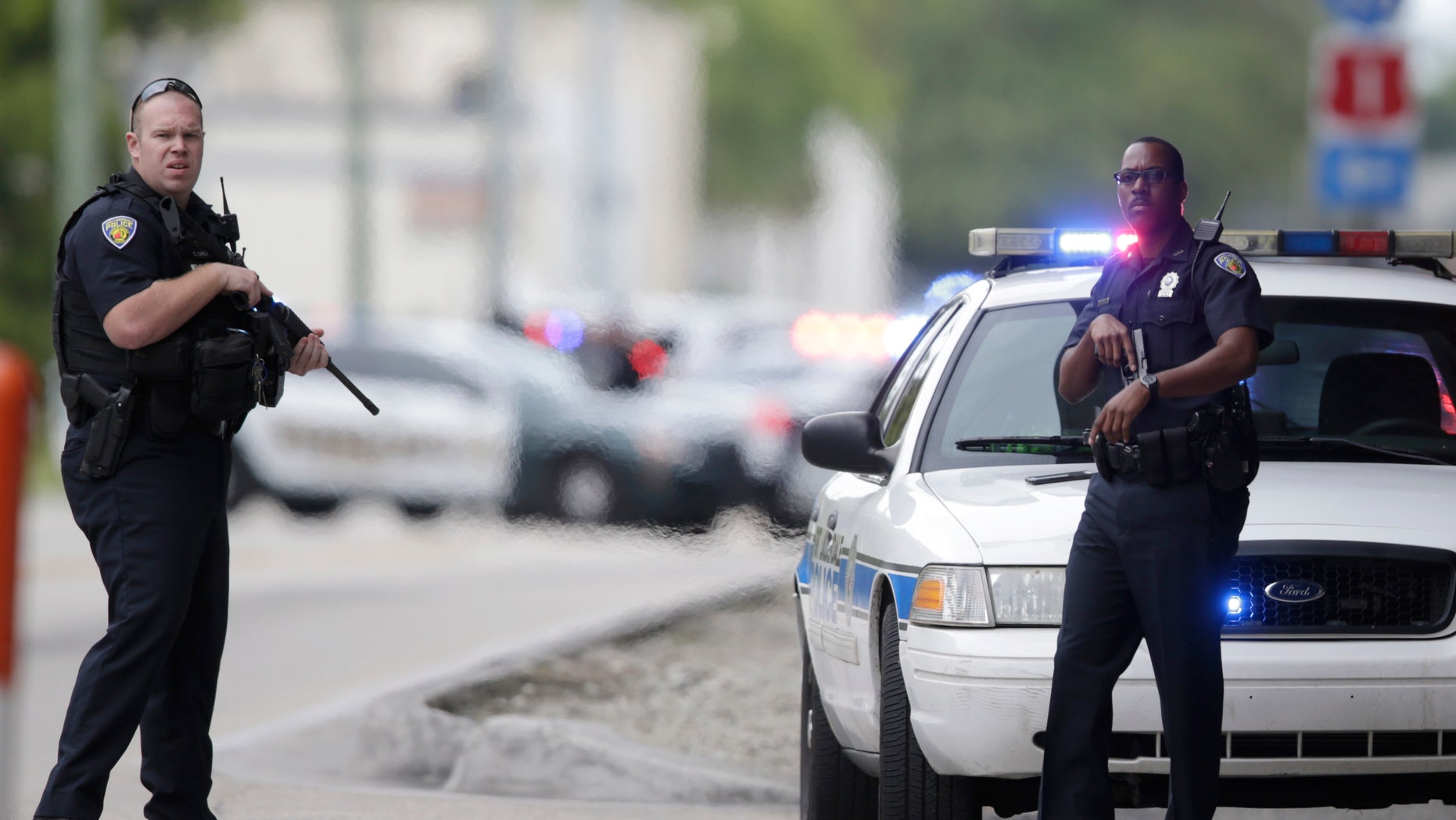 Police officers on guard outside the Fort Lauderdale-Hollywood International Airport, Jan. 6, 2017.