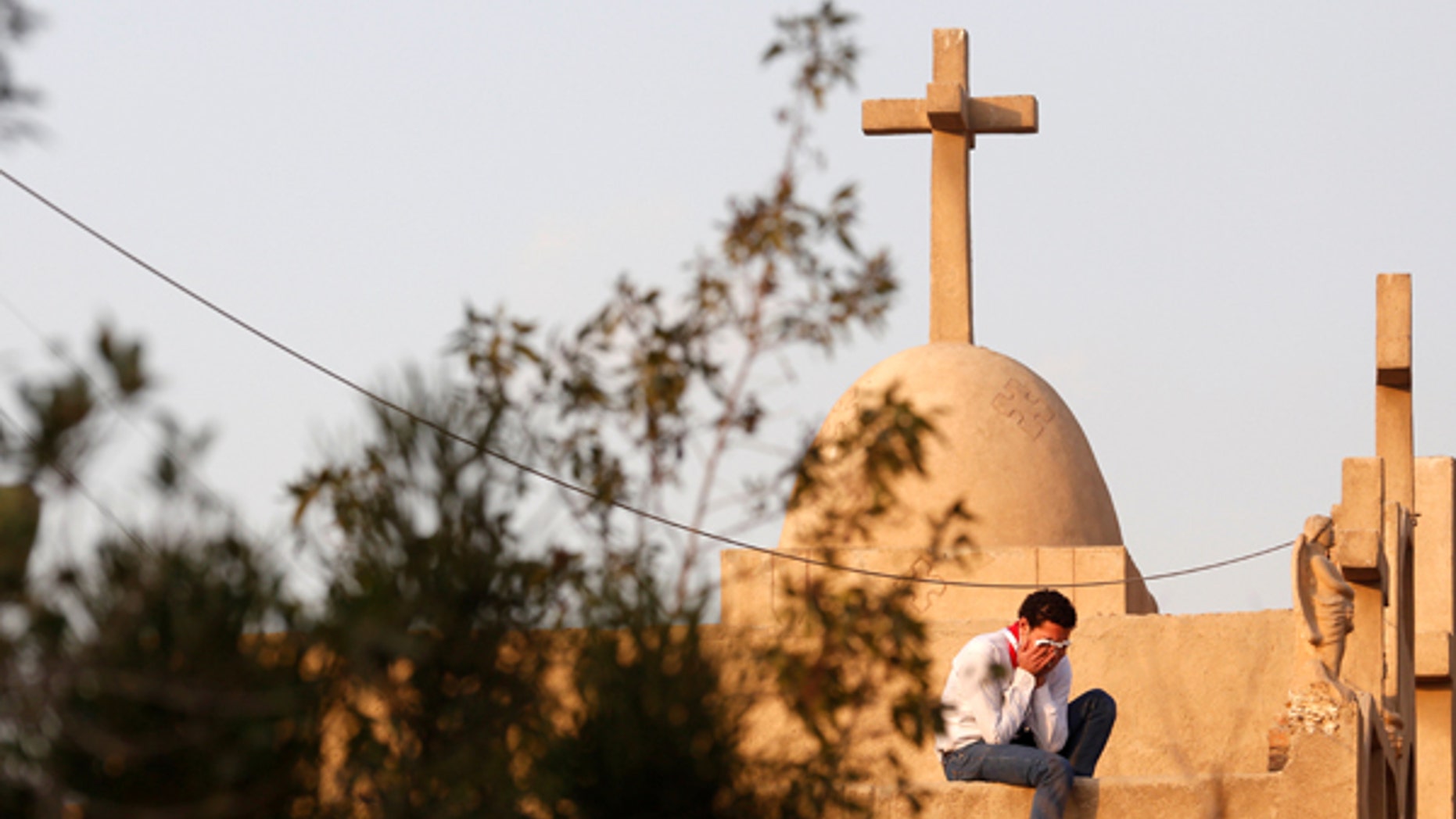 December 12, 2016: A man cries during the funeral of victims killed in the bombing of Cairo's Coptic cathedral, at the Mokattam Cemetery in Cairo, Egypt.