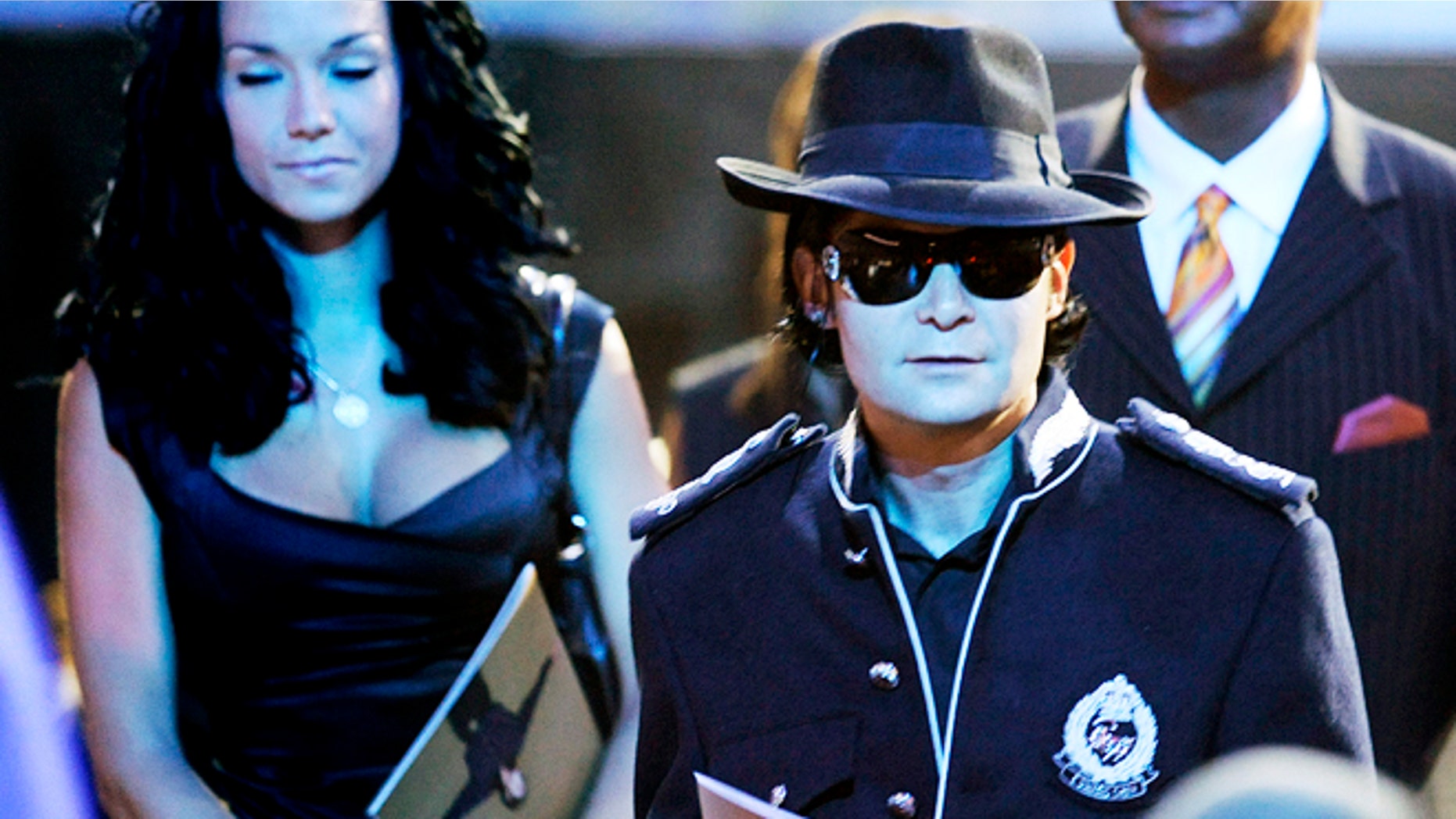 Actor Corey Feldman arrives at the memorial service for Michael Jackson at the Staples Center in Los Angeles July 7, 2009. Michael Jackson's family and close friends held a private service at a Los Angeles cemetery on Tuesday as fans crowded into the city's downtown area for a star-packed public memorial to the "King of Pop." REUTERS/Wally Skalij/Pool (UNITED STATES) - RTR25F4M